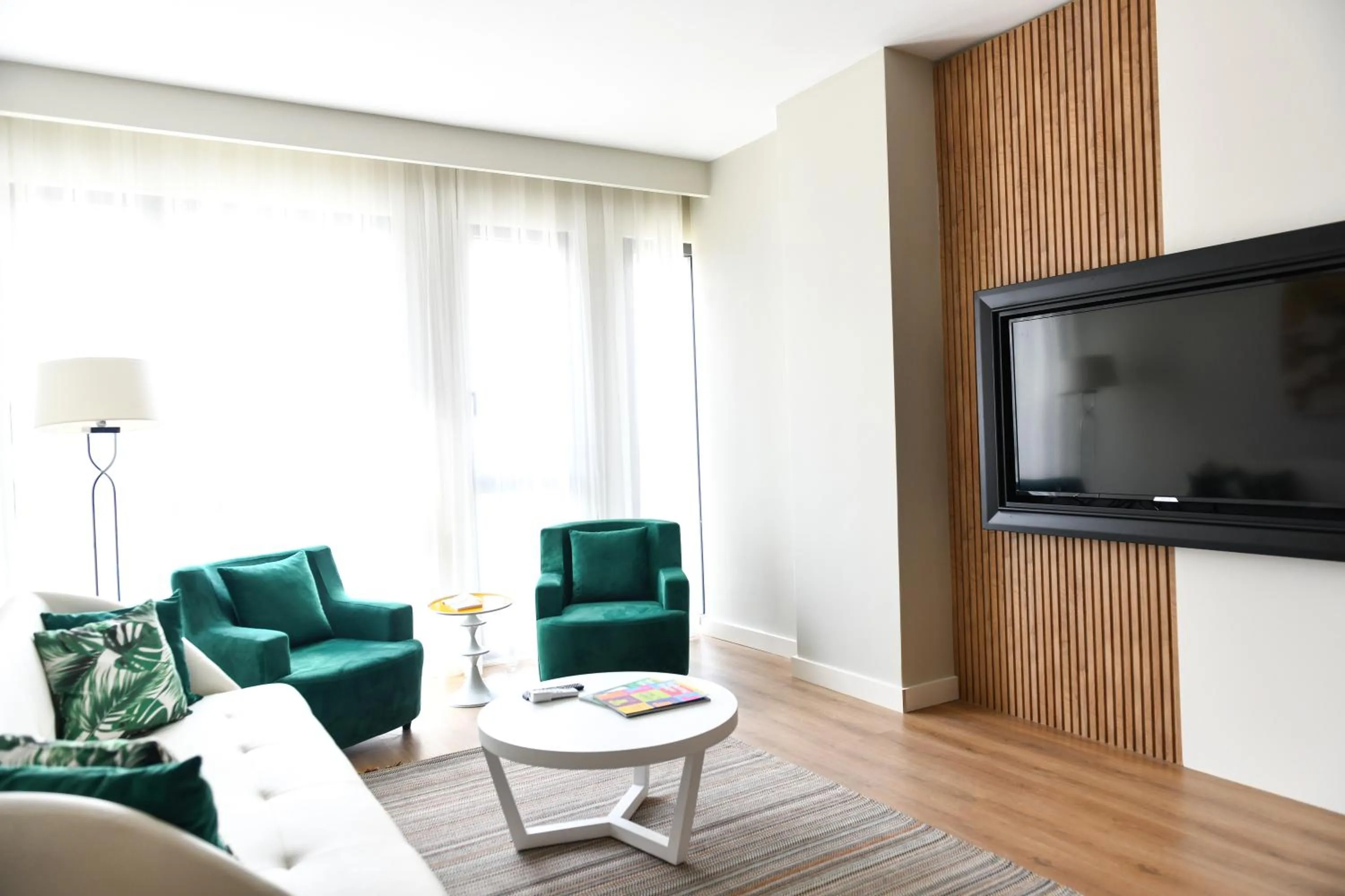 Communal lounge/ TV room in G Tower Furnished Apartment Rentals