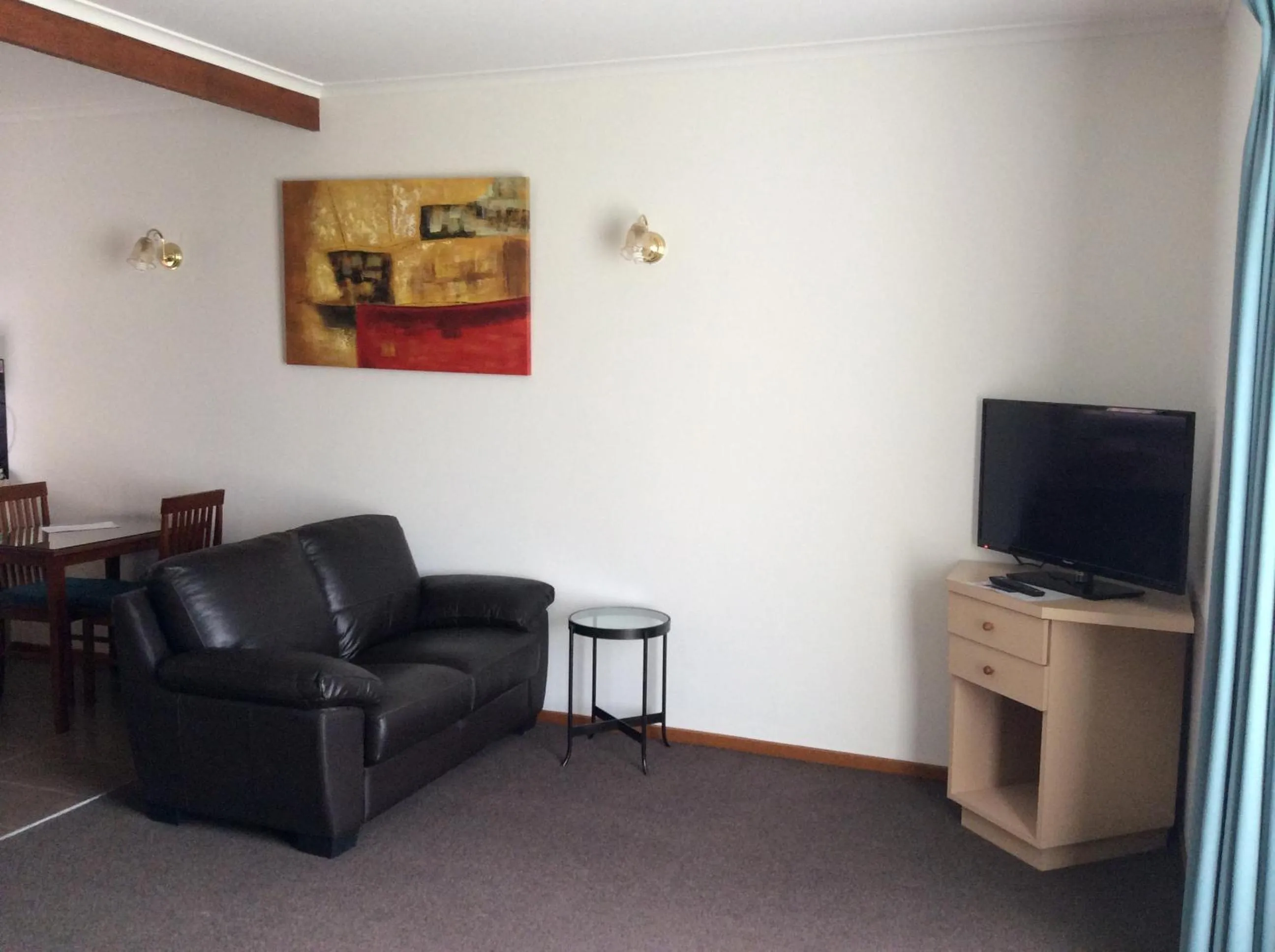 Living room in Ambassador Motor Inn