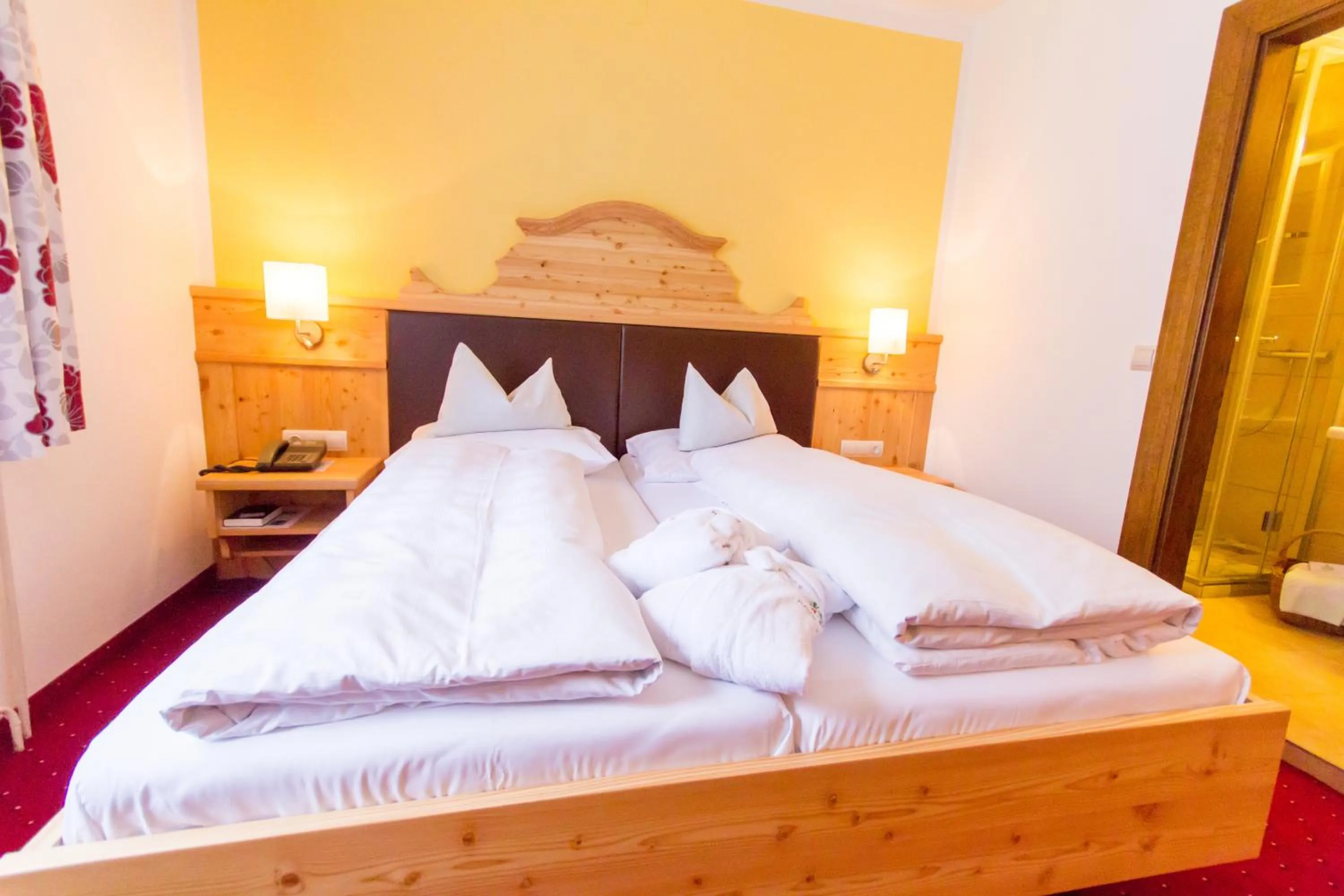 Bed in Hotel Trattlerhof