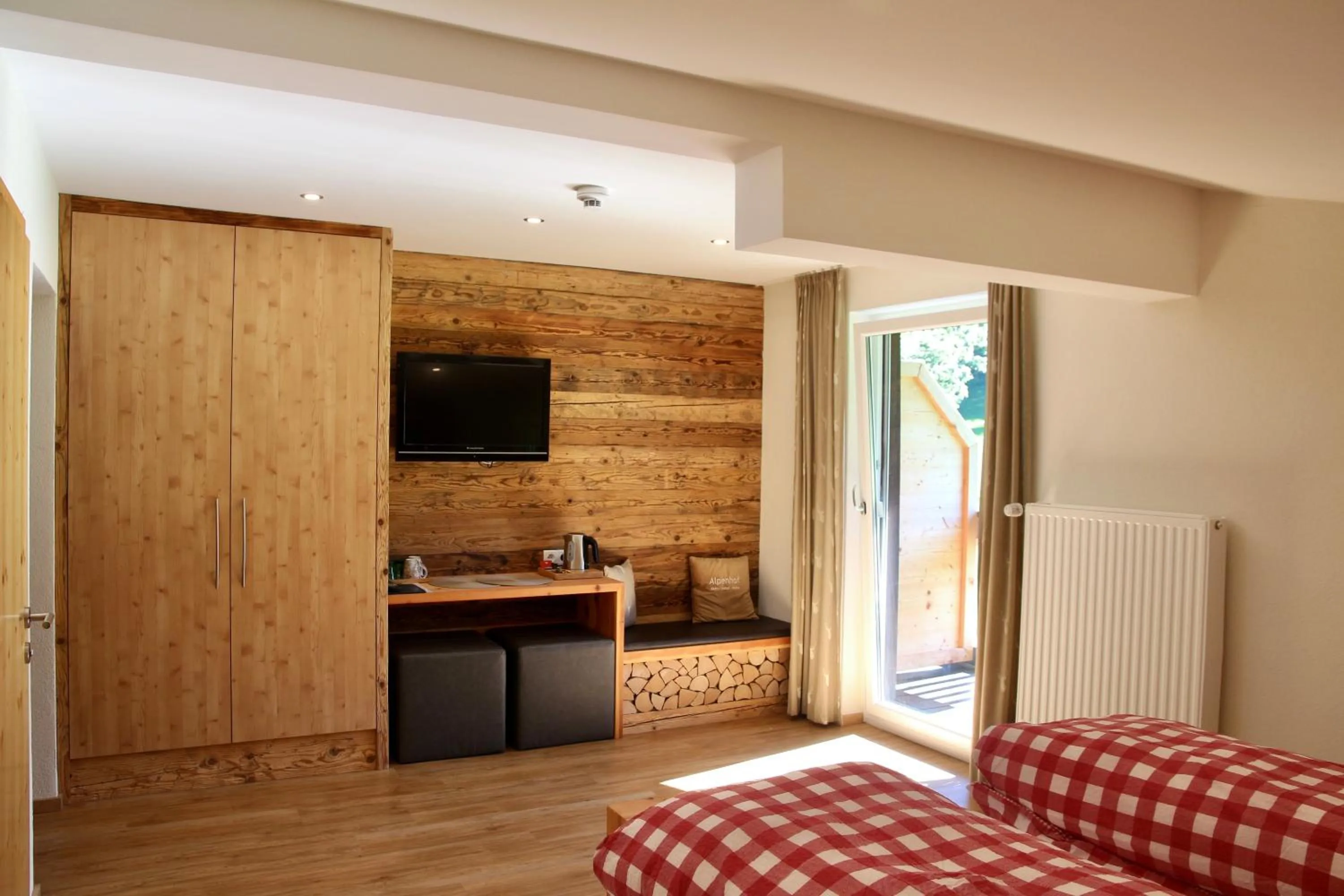 Photo of the whole room, Bed in Boutique Hotel Alpenhof