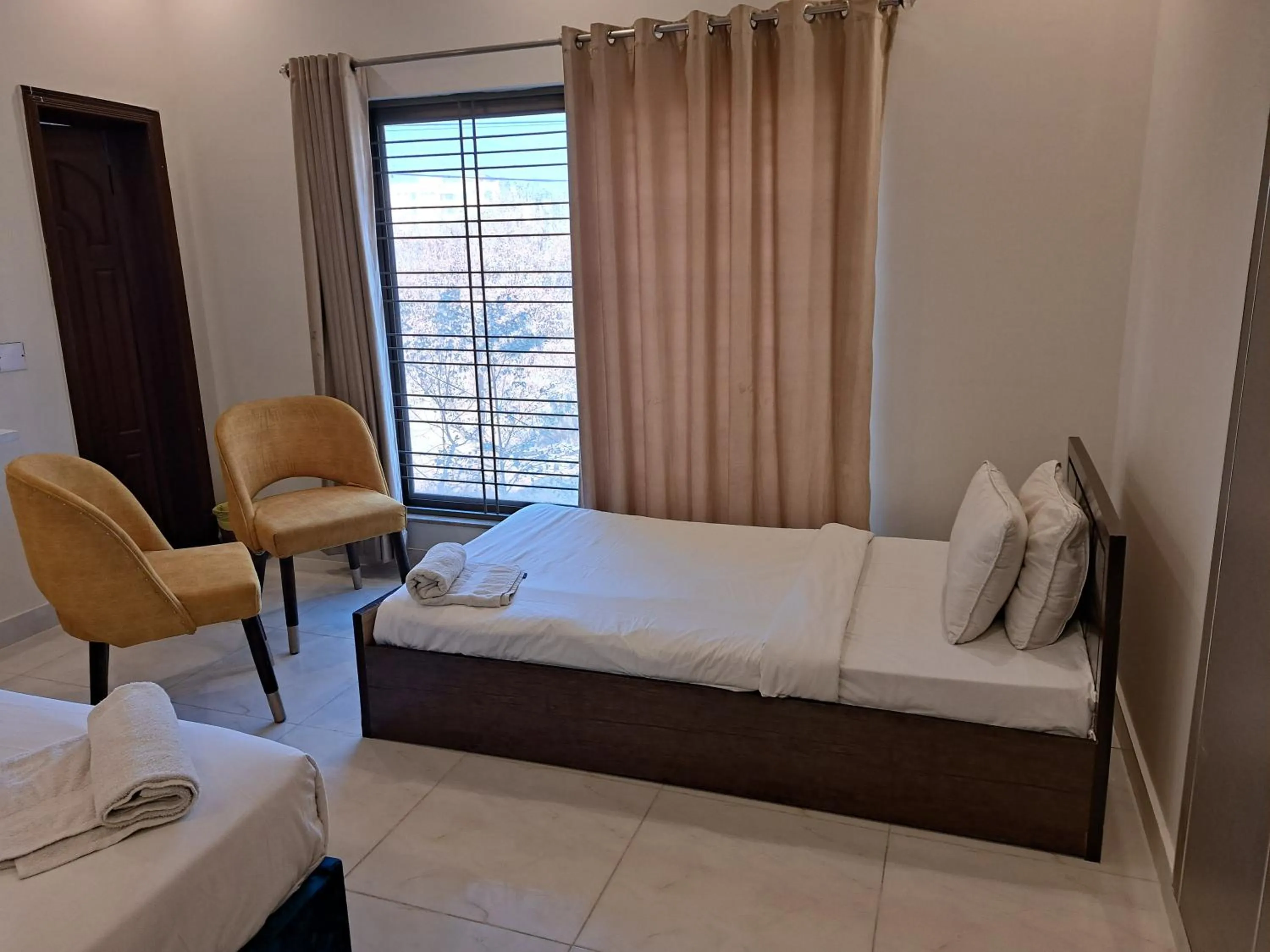 Bed in Cuzzy Inn Hotel