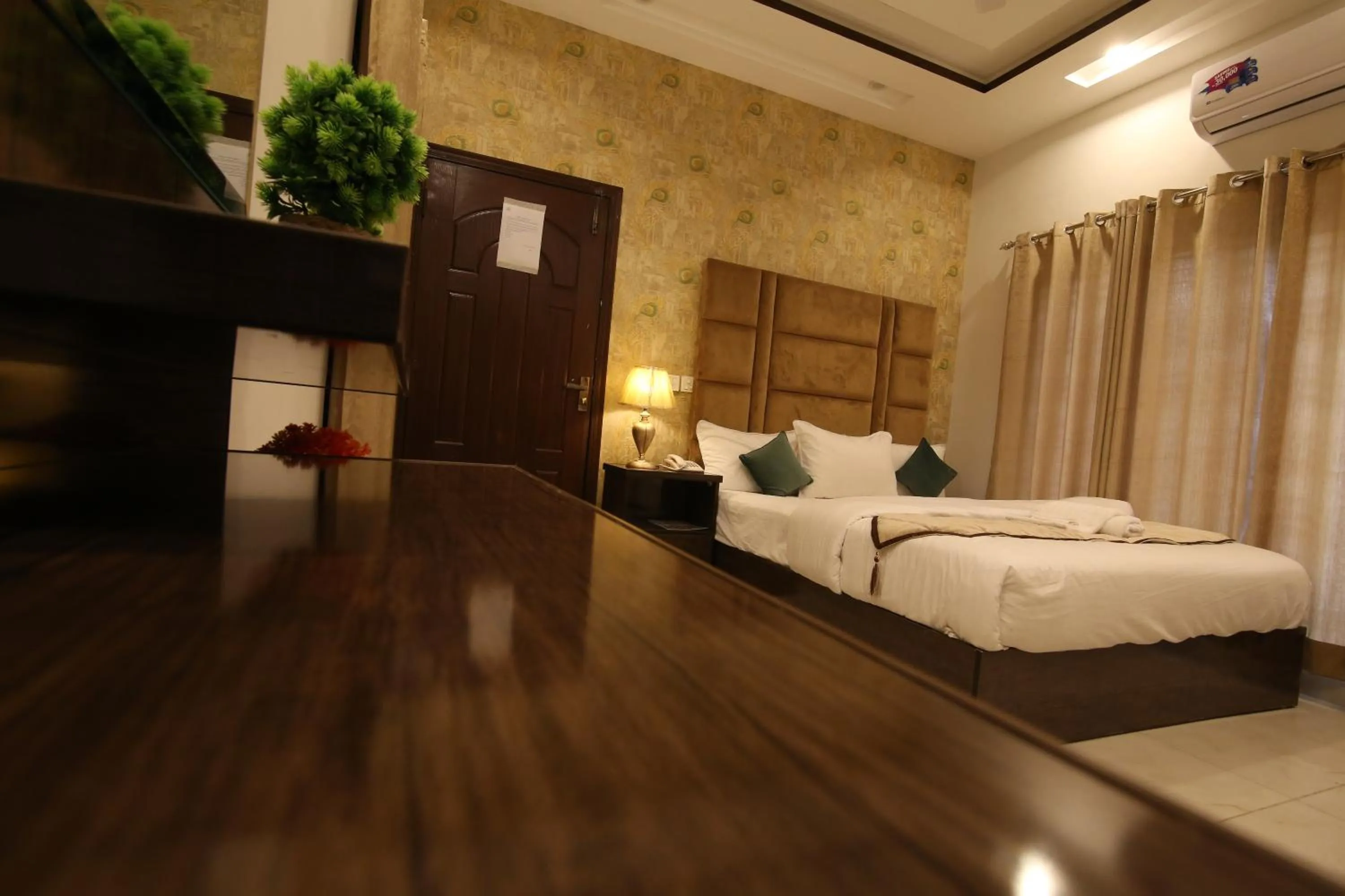 Bed in Cuzzy Inn Hotel