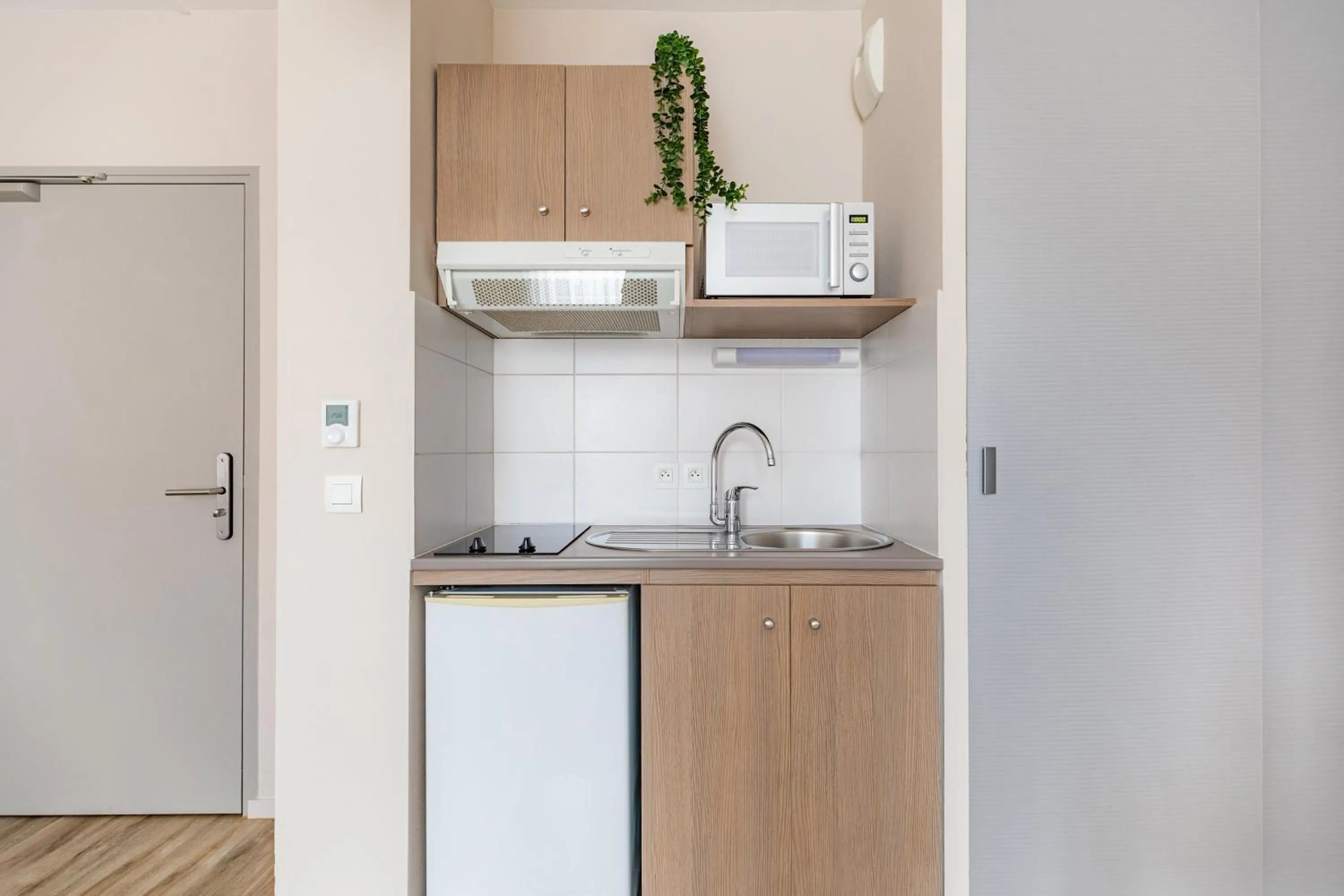 Kitchen or kitchenette in Appart'City Confort Cherbourg