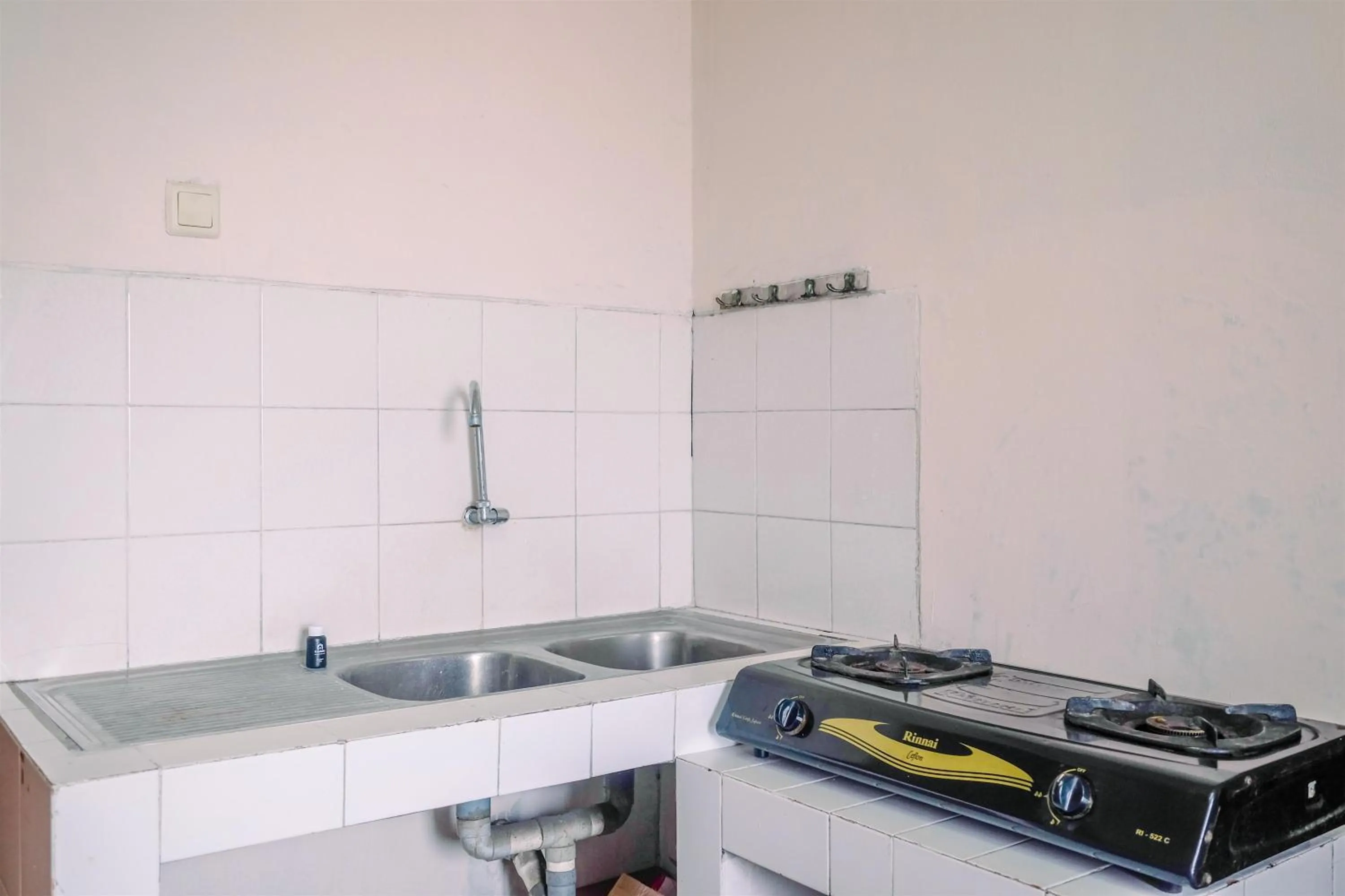 Kitchen or kitchenette in Spacious and Strategic 3BR Kondominium Juanda Apartment By Travelio