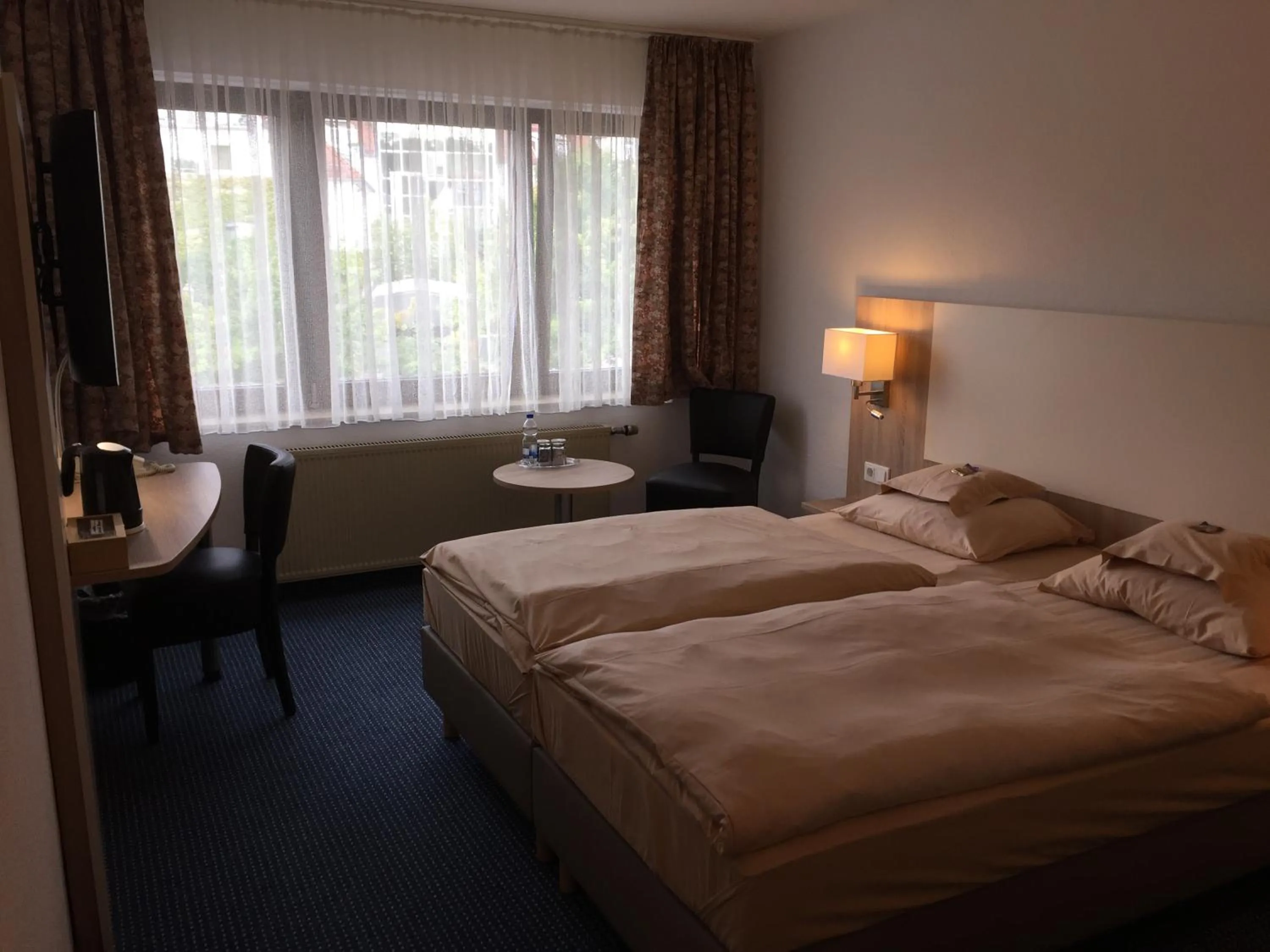 Photo of the whole room, Bed in Hotel Kelkheimer Hof