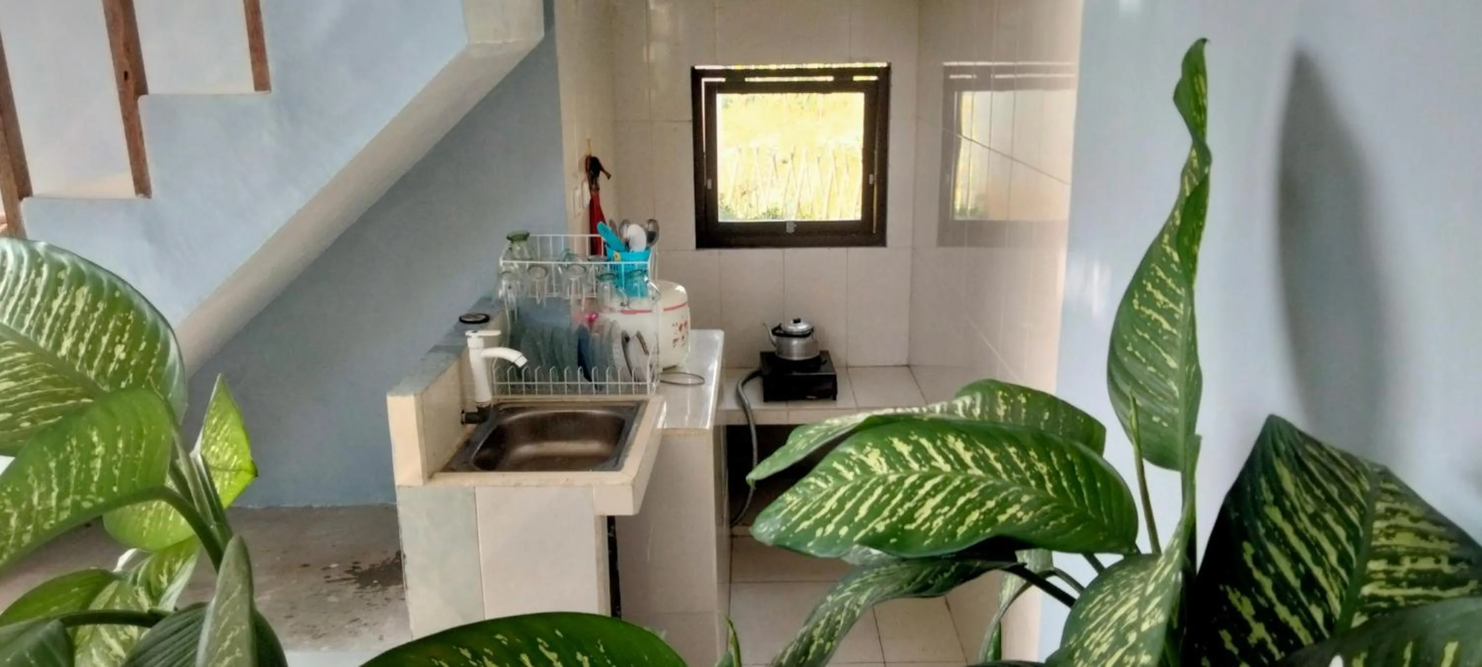 kitchen in Villa Kebun Jeruk Syariah Malang by ecommerceloka