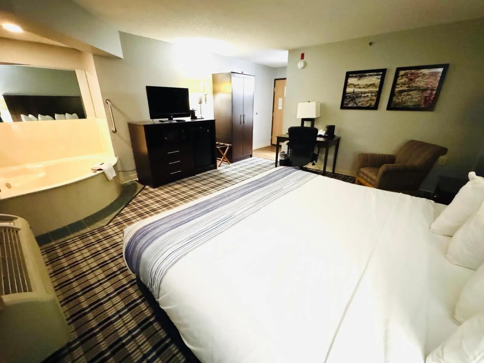 Bedroom, Bed in AmericInn by Wyndham Ames