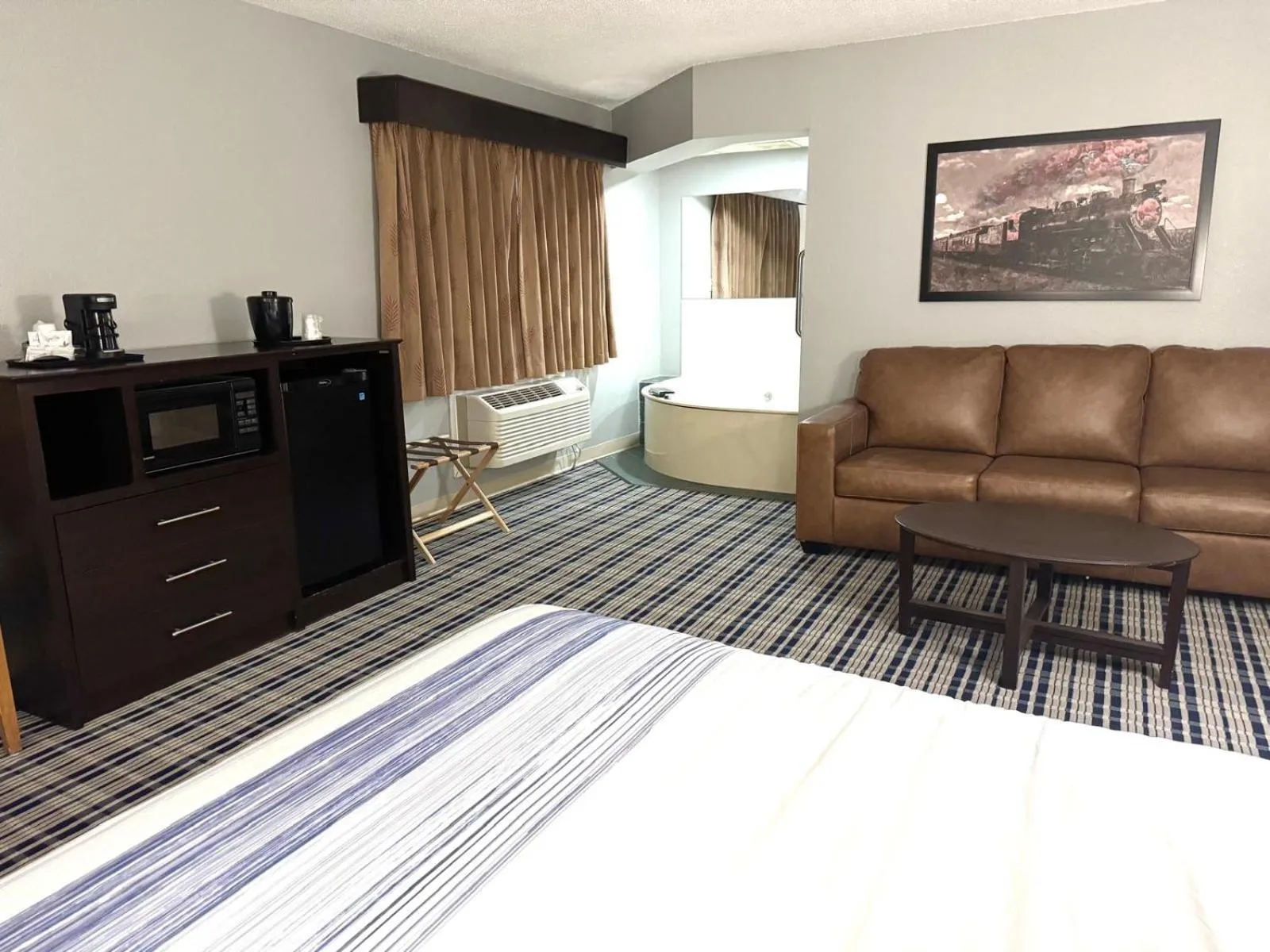 Bedroom in AmericInn by Wyndham Ames