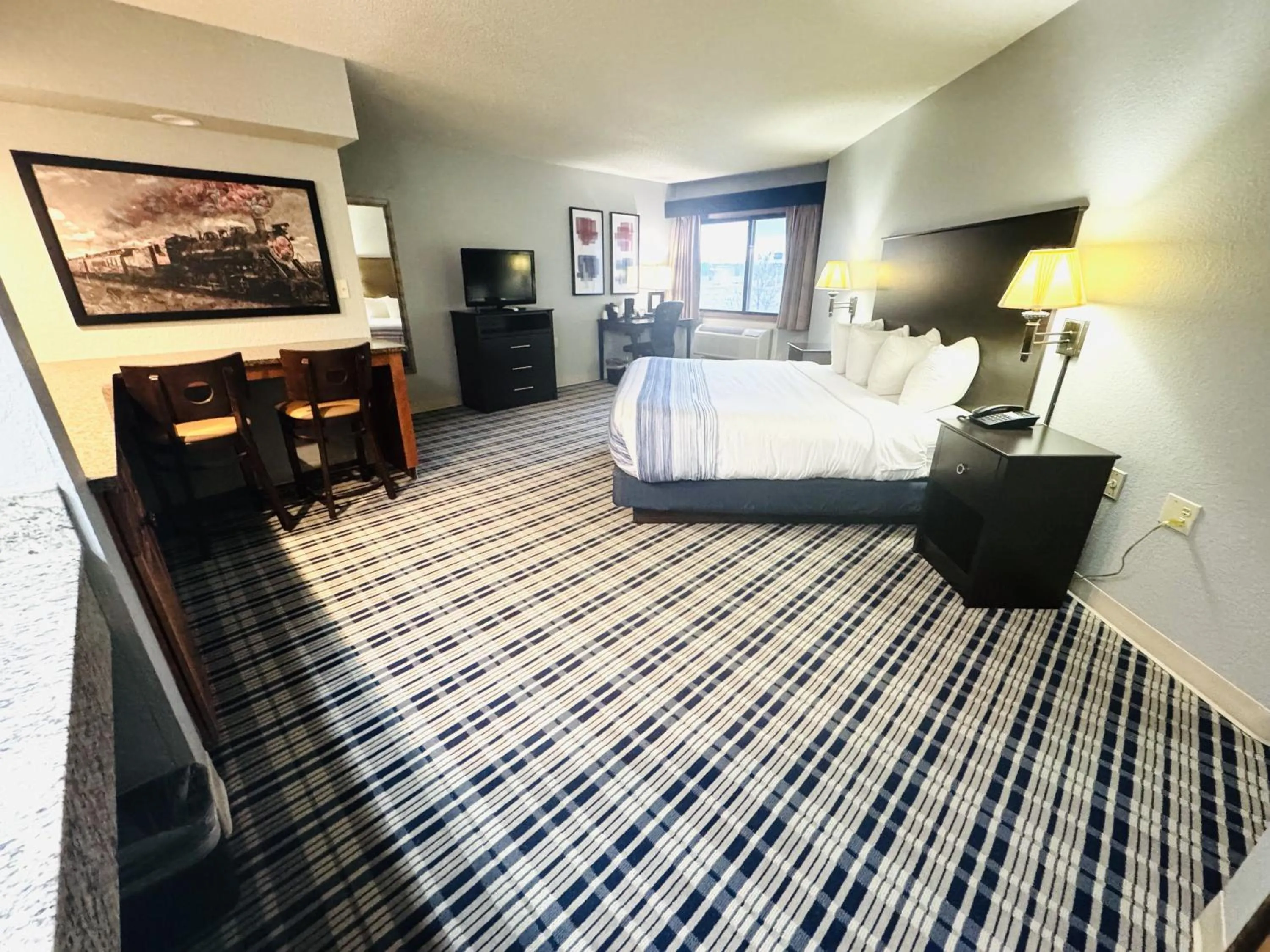 Bedroom, Bed in AmericInn by Wyndham Ames