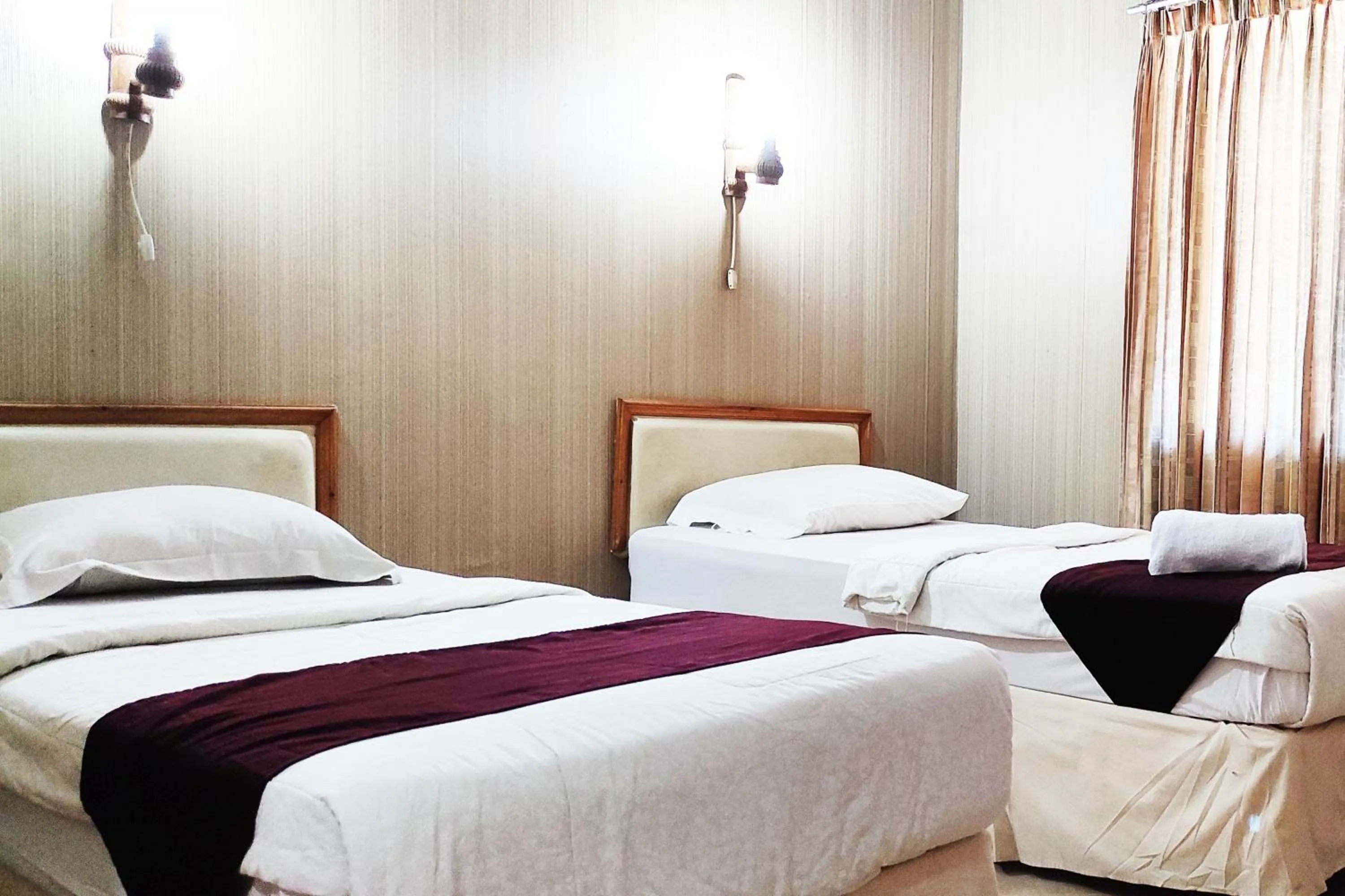 Bed in Hotel Salma Syariah Mitra RedDoorz near Terminal Baru Kediri