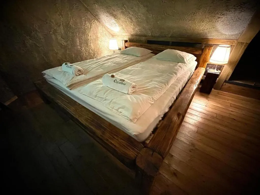 Bed in Excalibur miniHotel