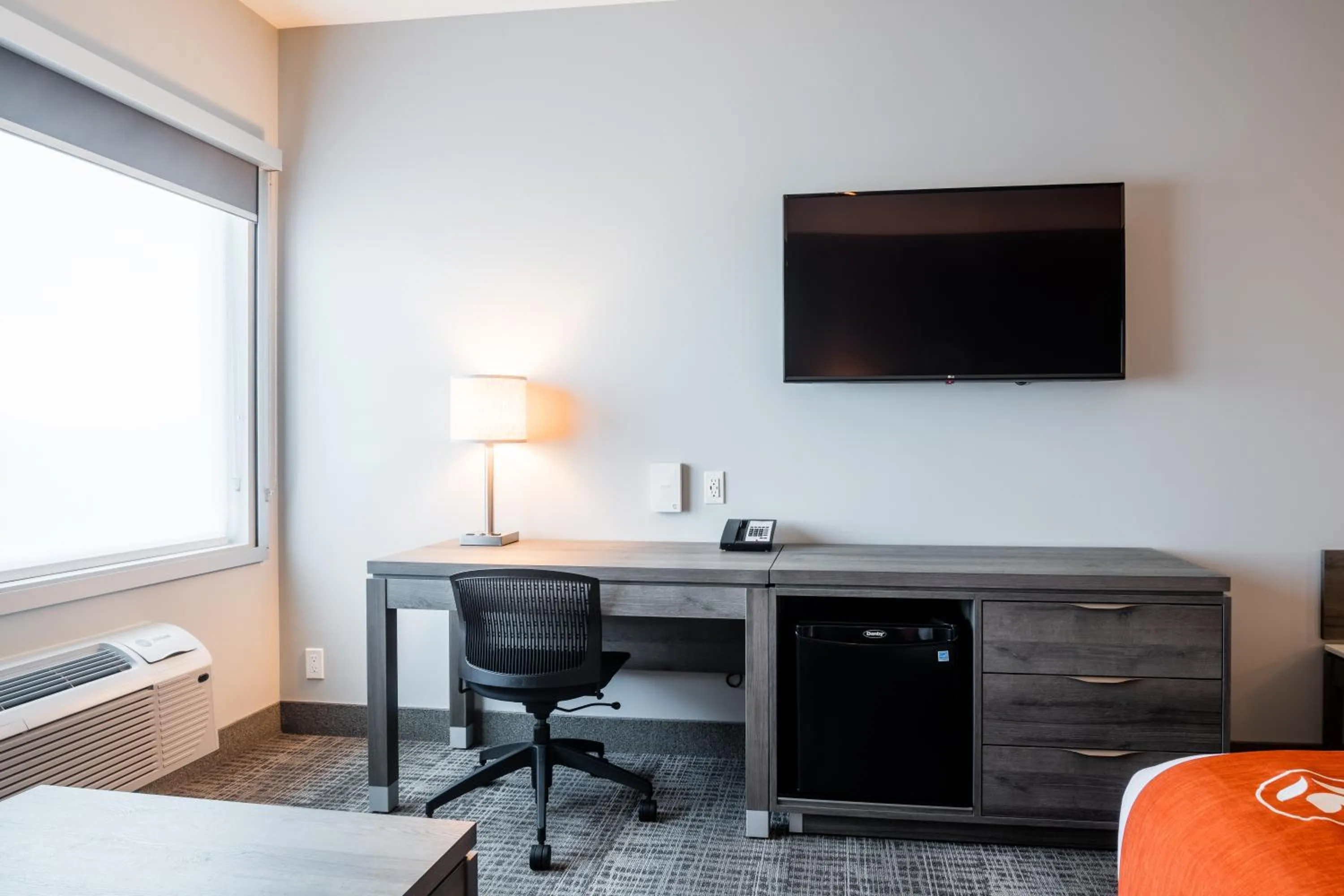 Living room in Amsterdam Inn & Suites, an Ascend Collection Hotel