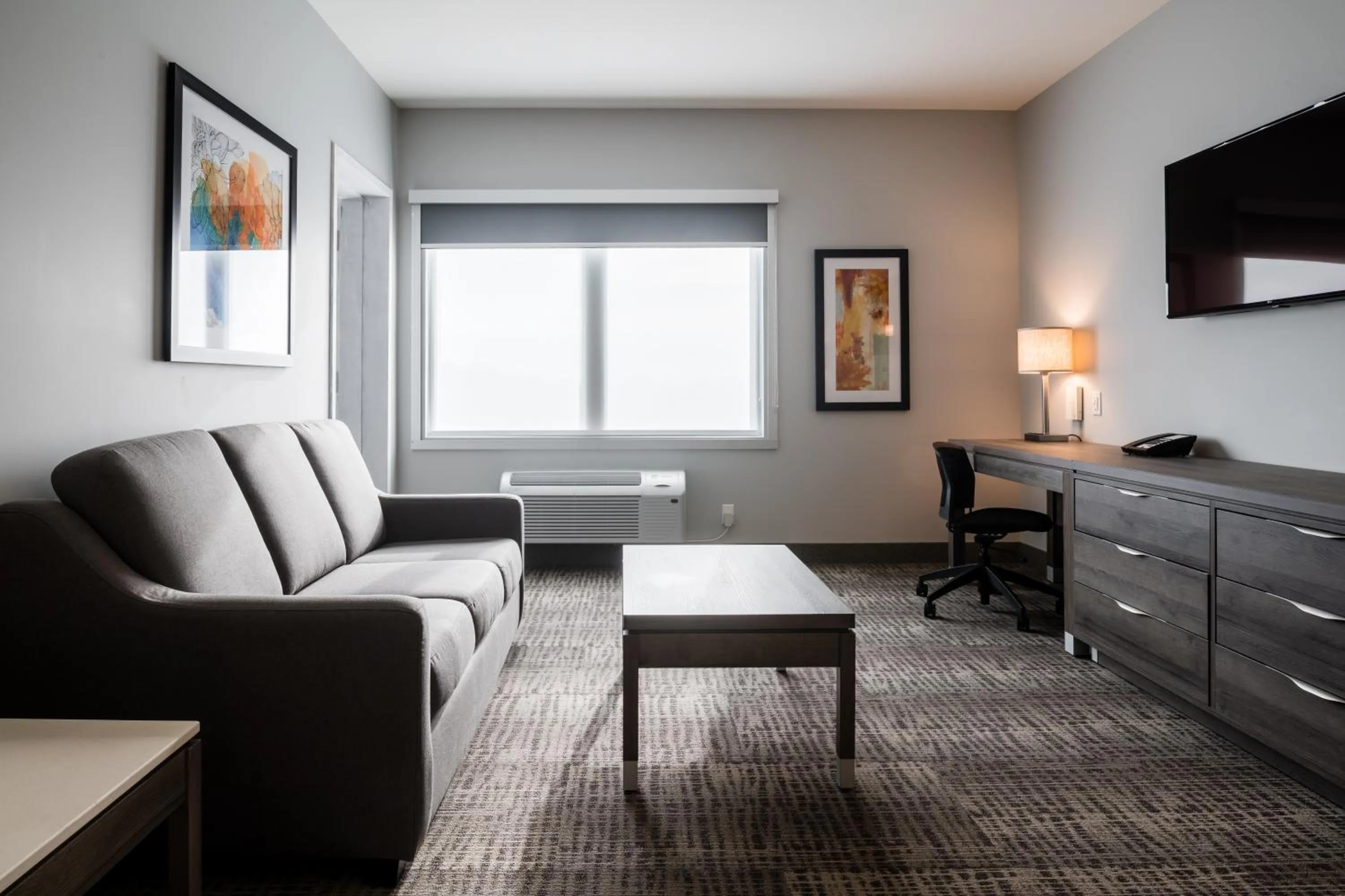 Living room in Amsterdam Inn & Suites, an Ascend Collection Hotel