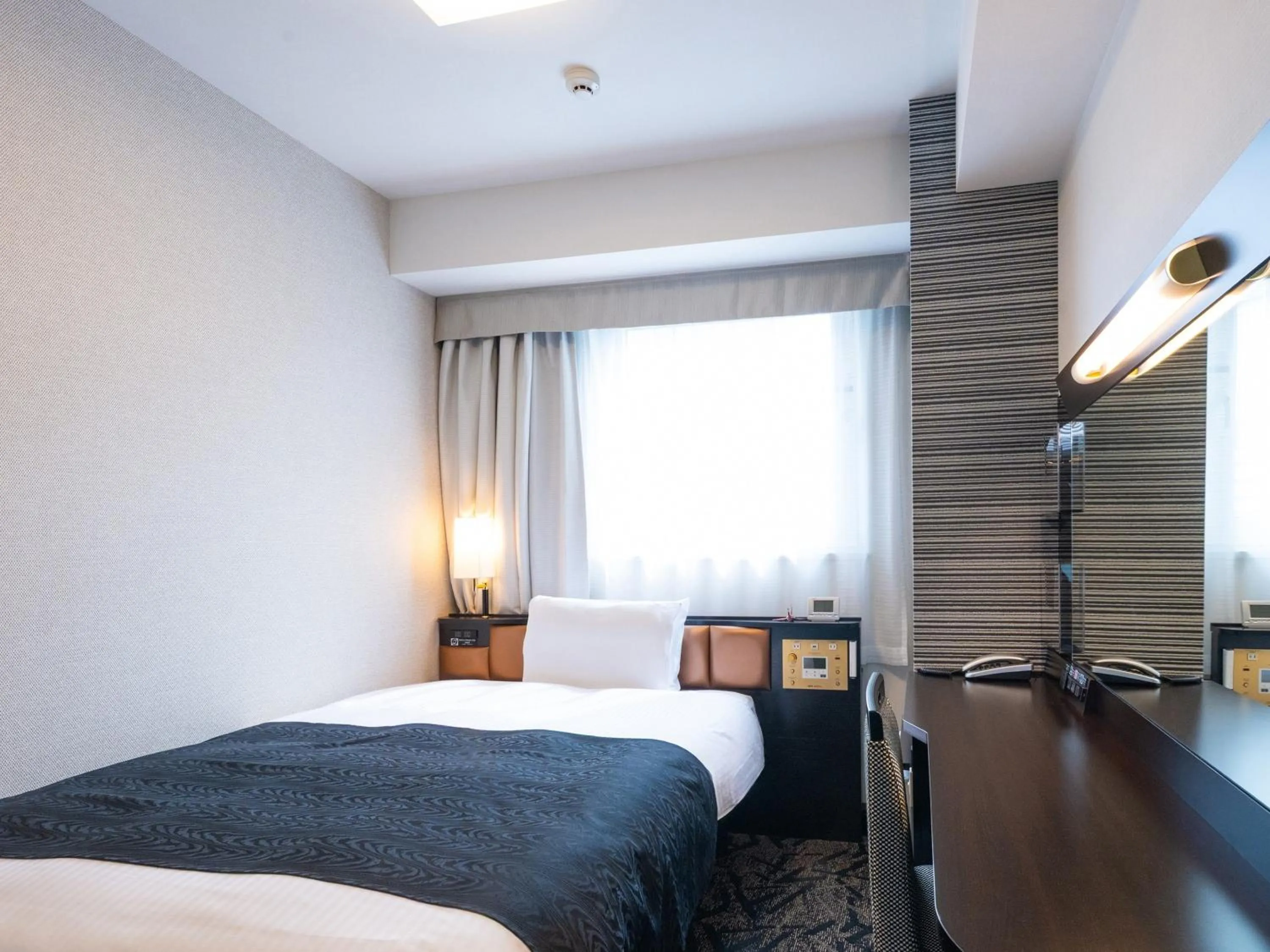 Photo of the whole room, Bed in APA Hotel Nagoya Ekimae