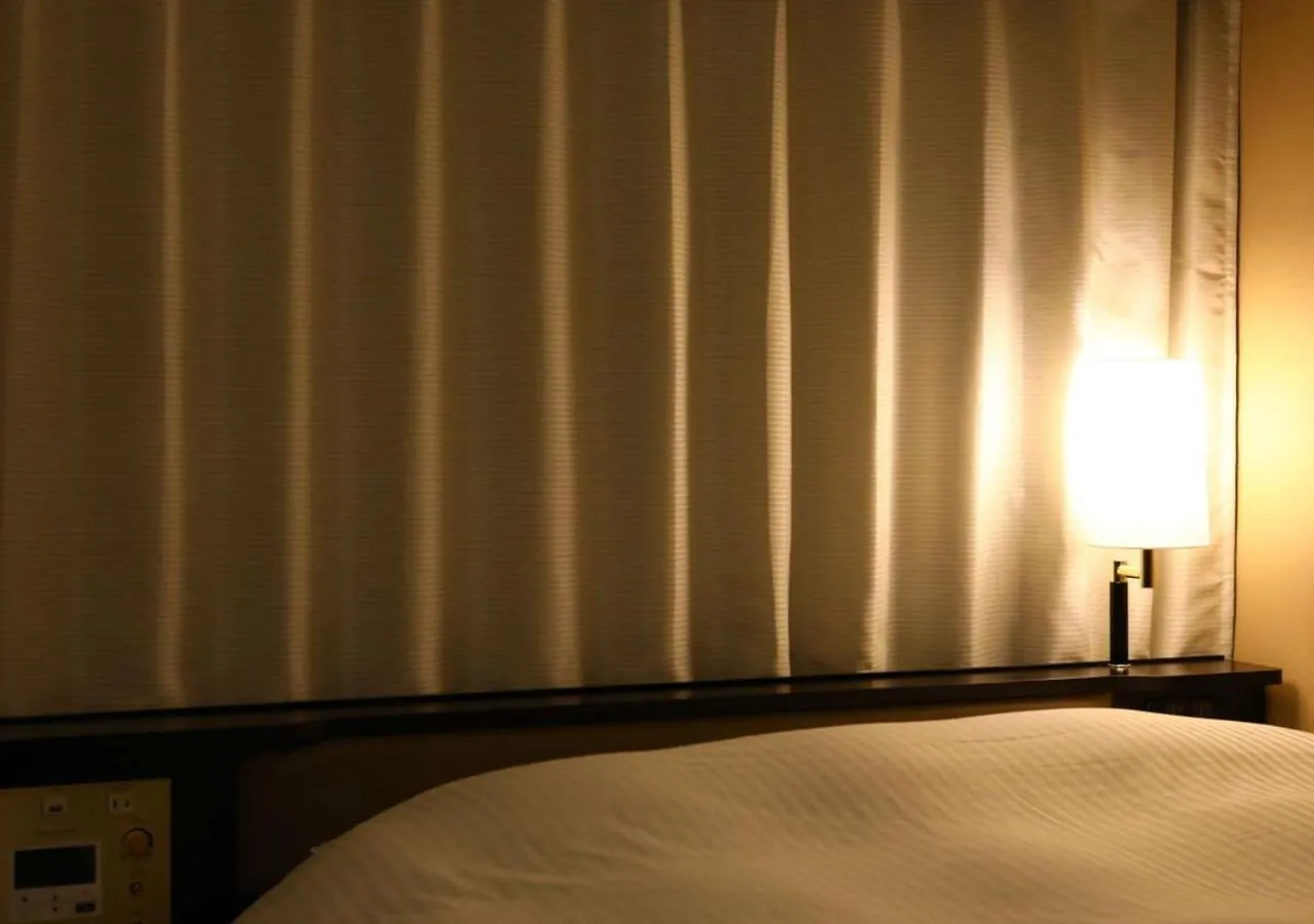 Photo of the whole room, Bed in APA Hotel Nagoya Ekimae