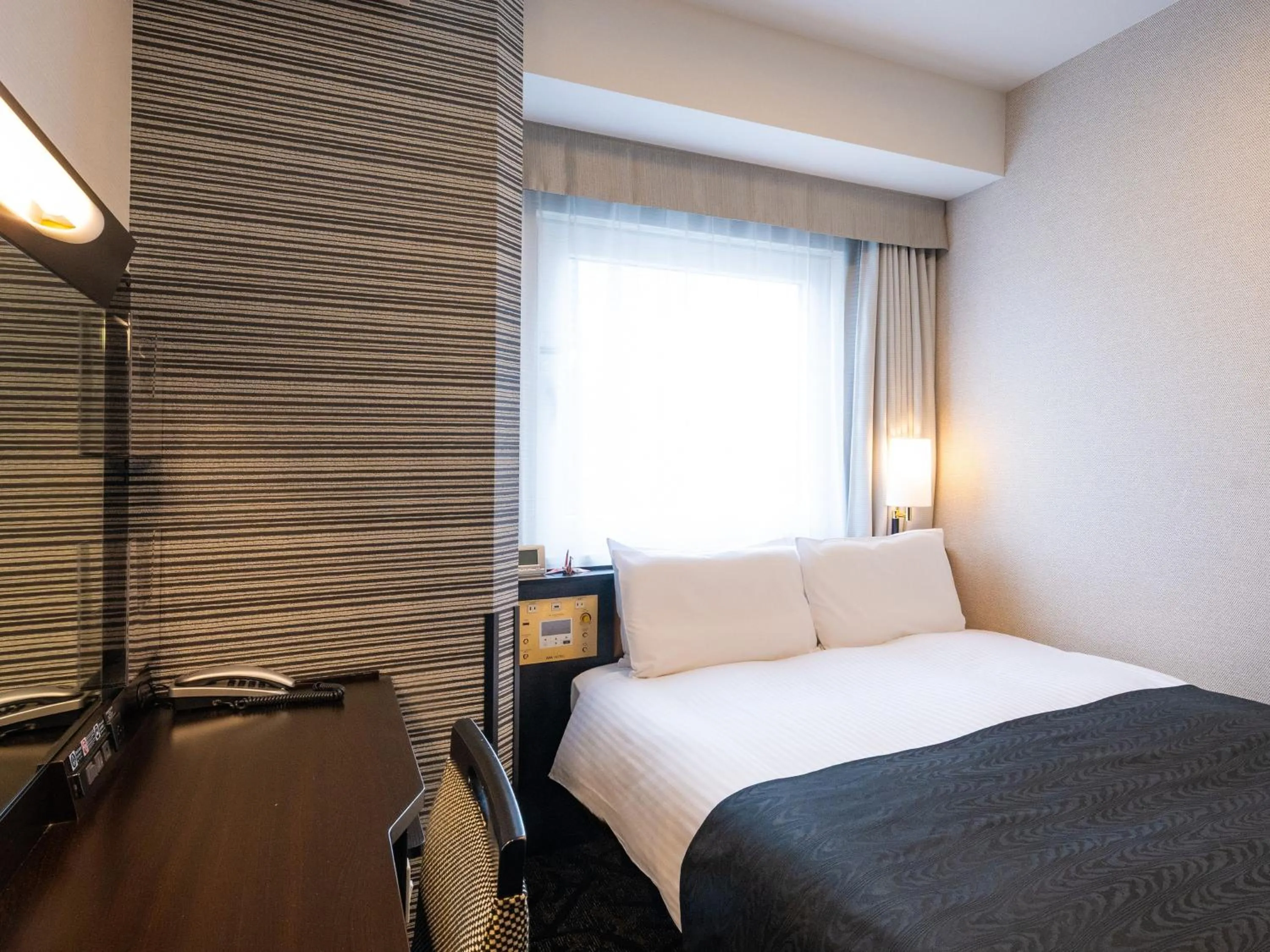 Photo of the whole room, Bed in APA Hotel Nagoya Ekimae