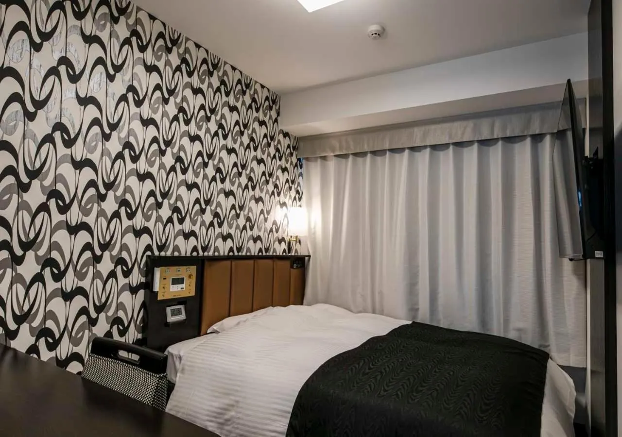 Photo of the whole room, Bed in APA Hotel Nagoya Ekimae