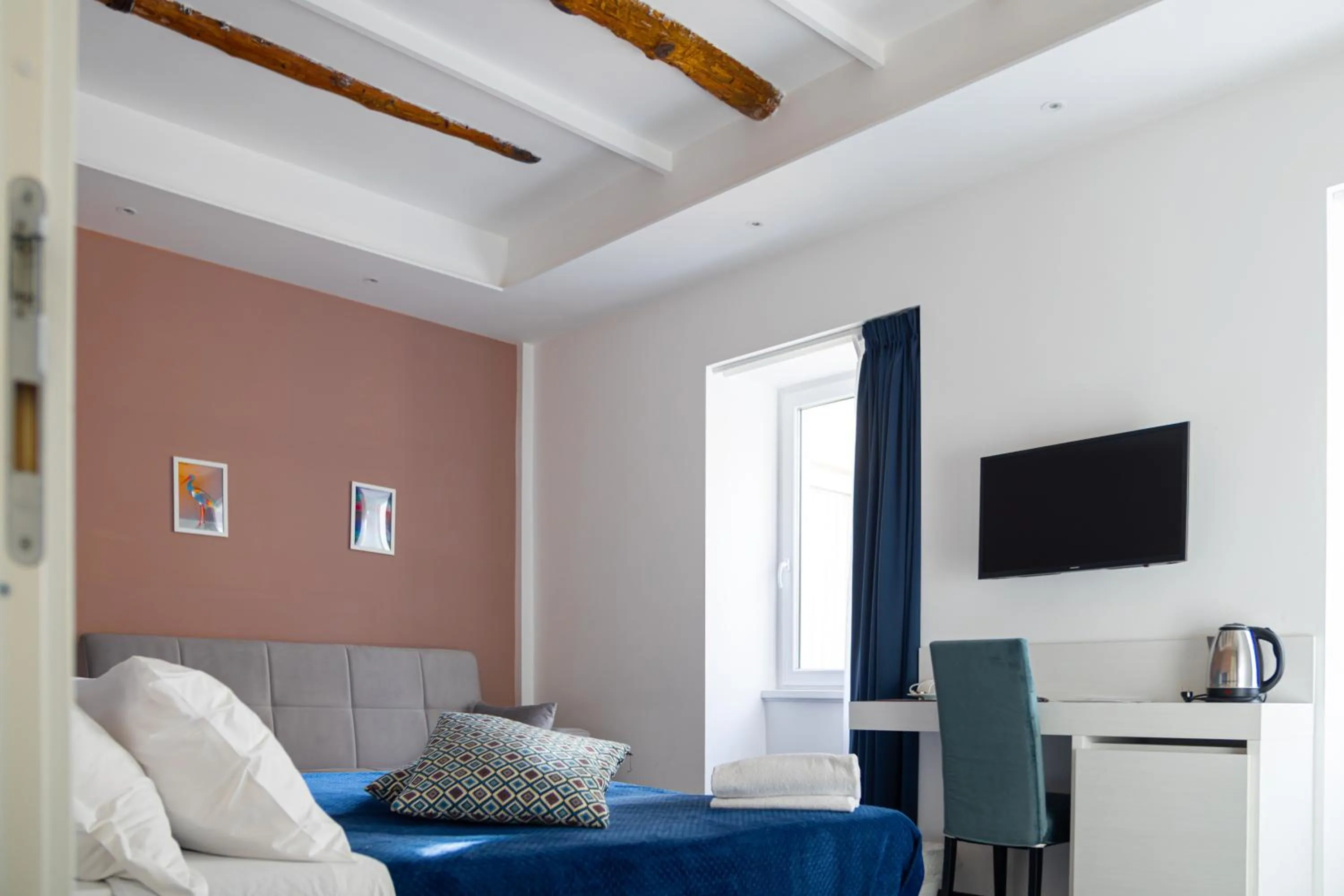 Bed in Palazzo Cappuccini Art Relais