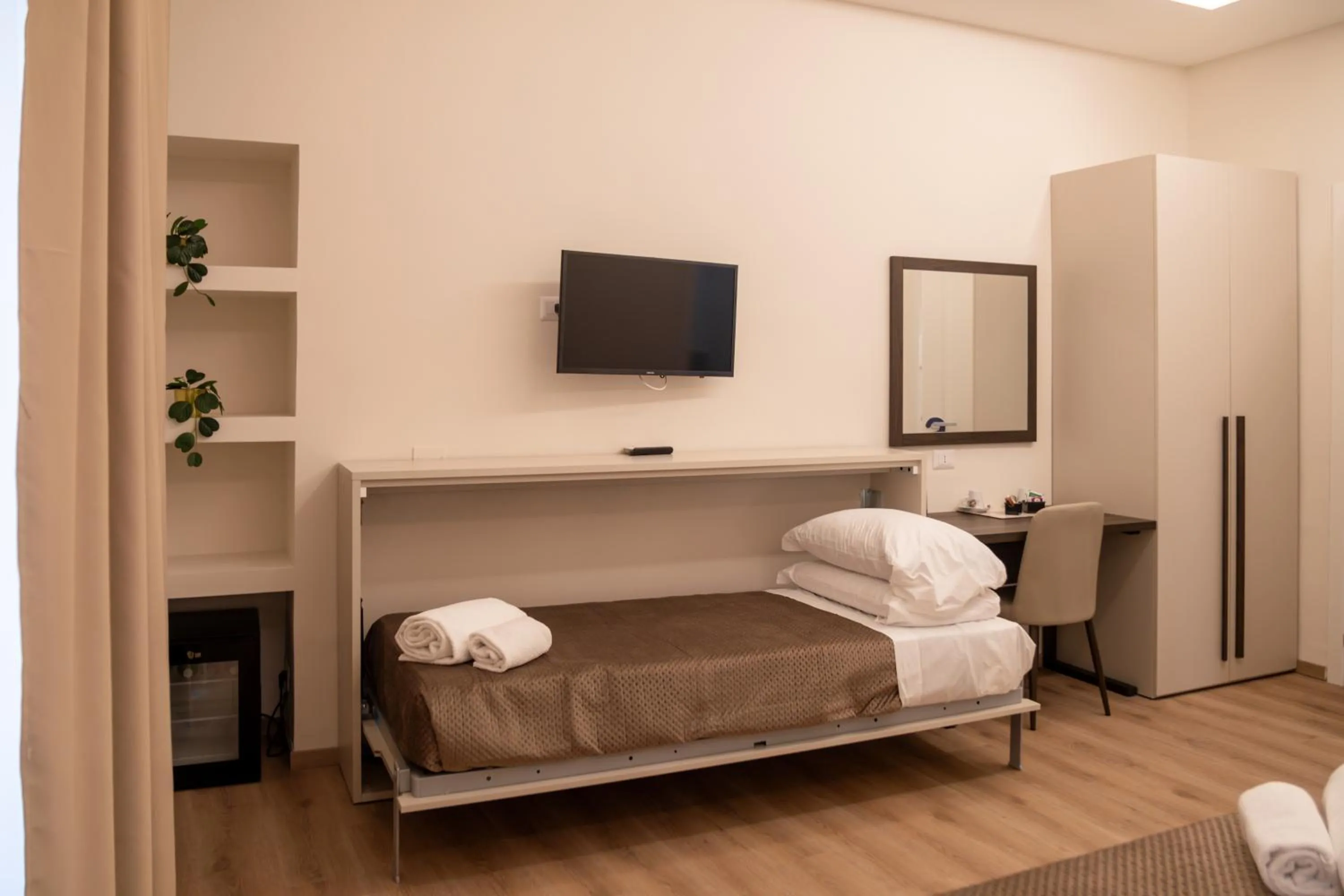 Bed in Palazzo Cappuccini Art Relais