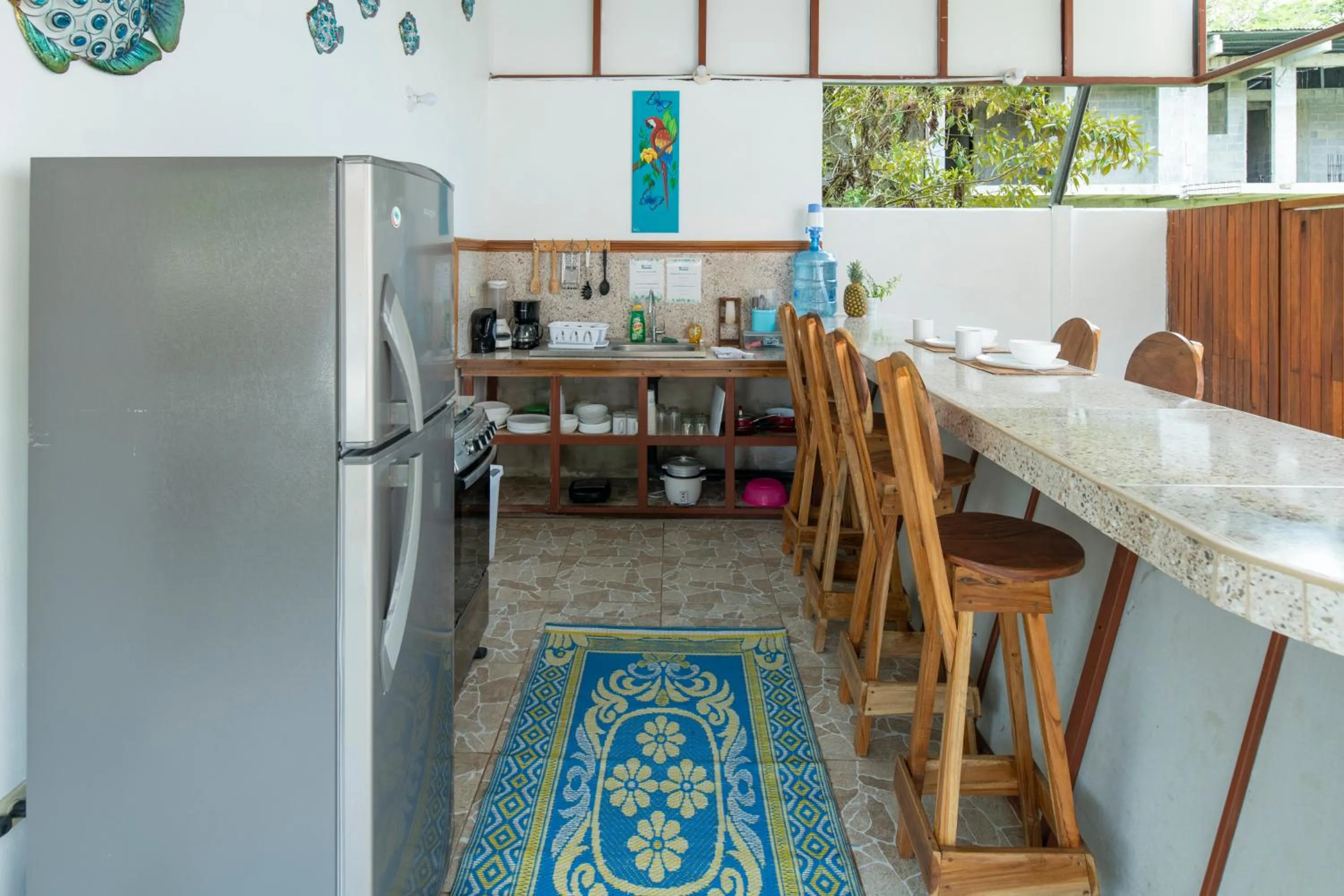Communal kitchen in Pangea Lodge with Shared Pool at the Heart of Manzanillo
