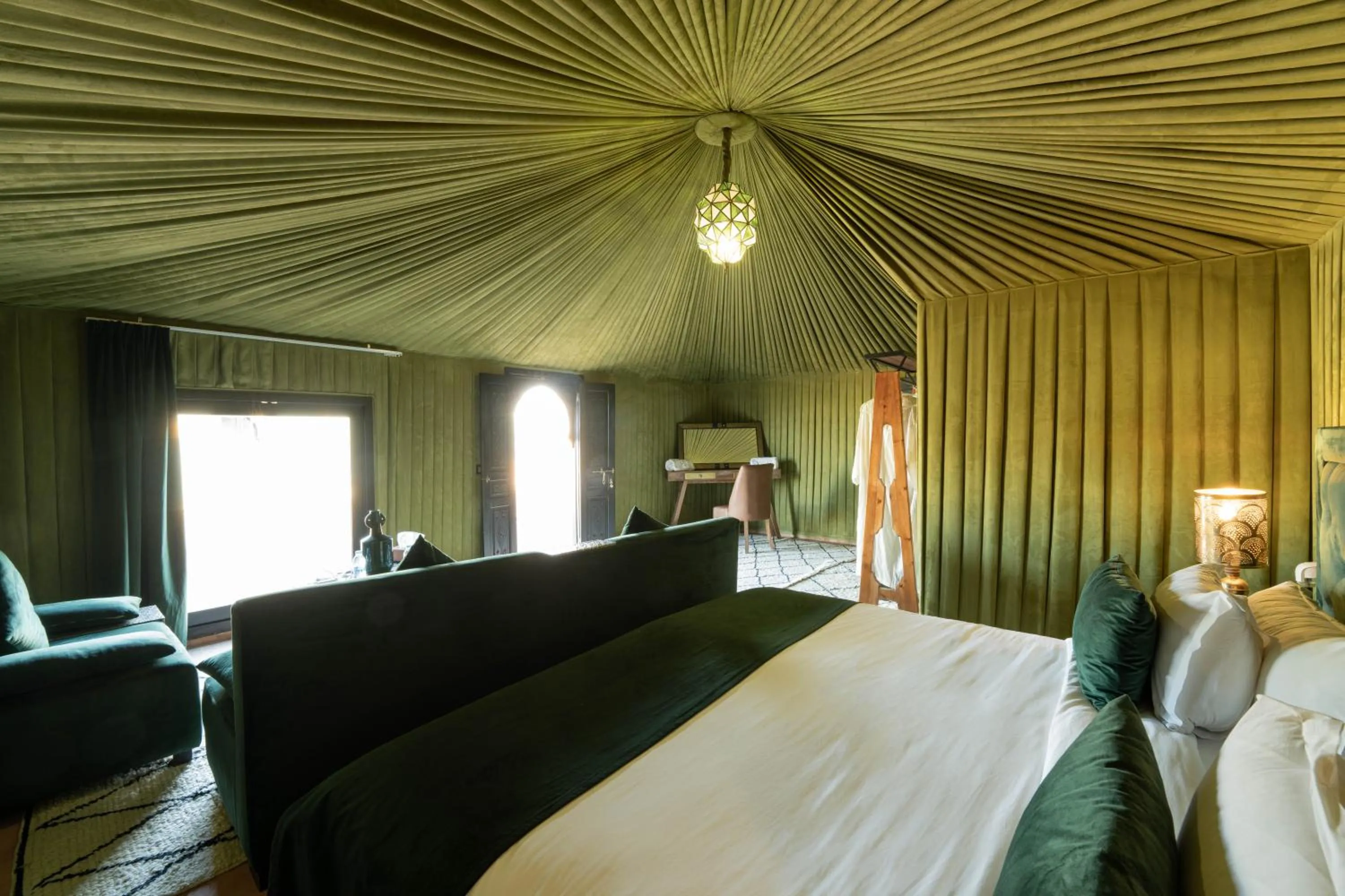Bed in Kalyptus Luxury Camp
