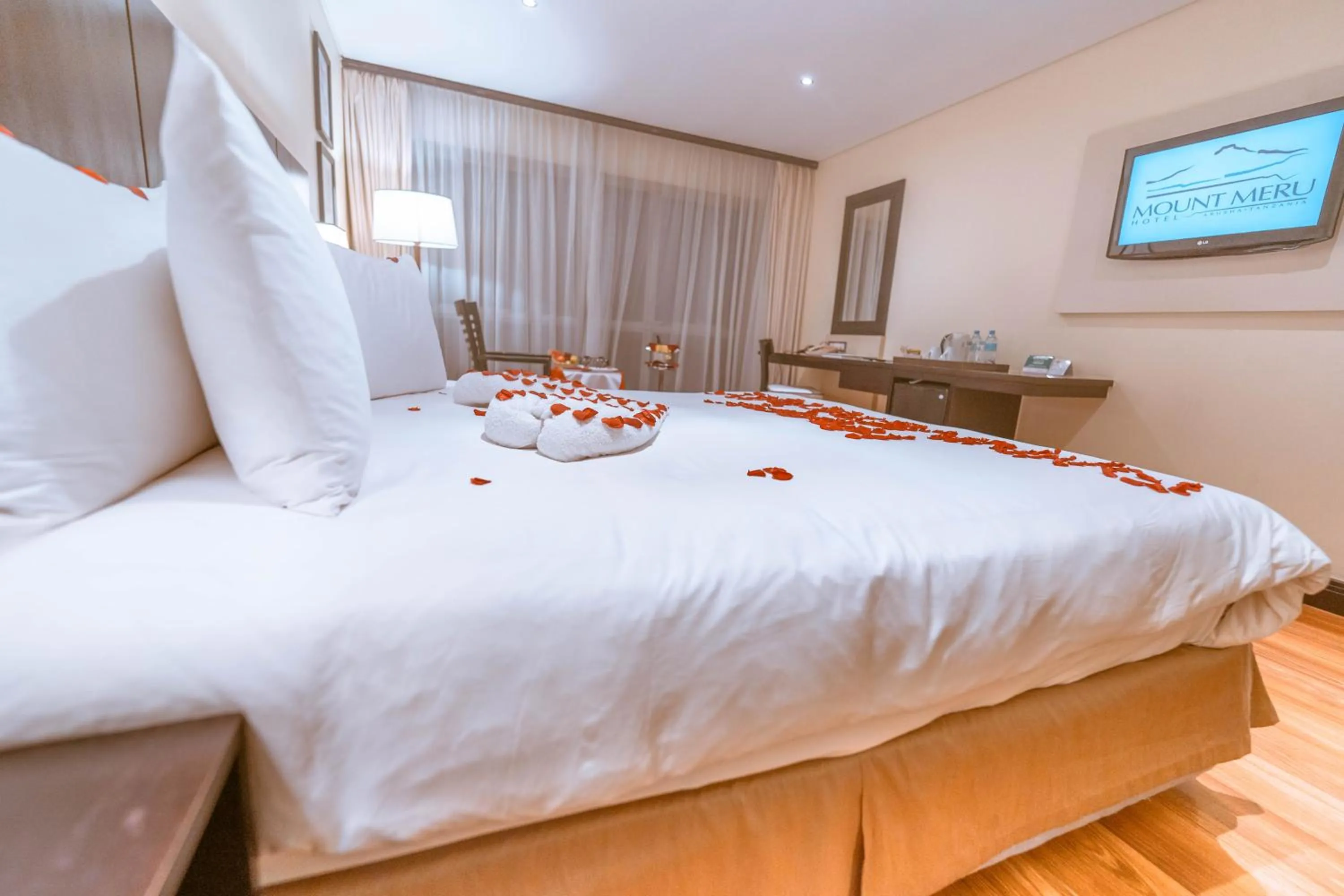 Bed in Mount Meru Hotel