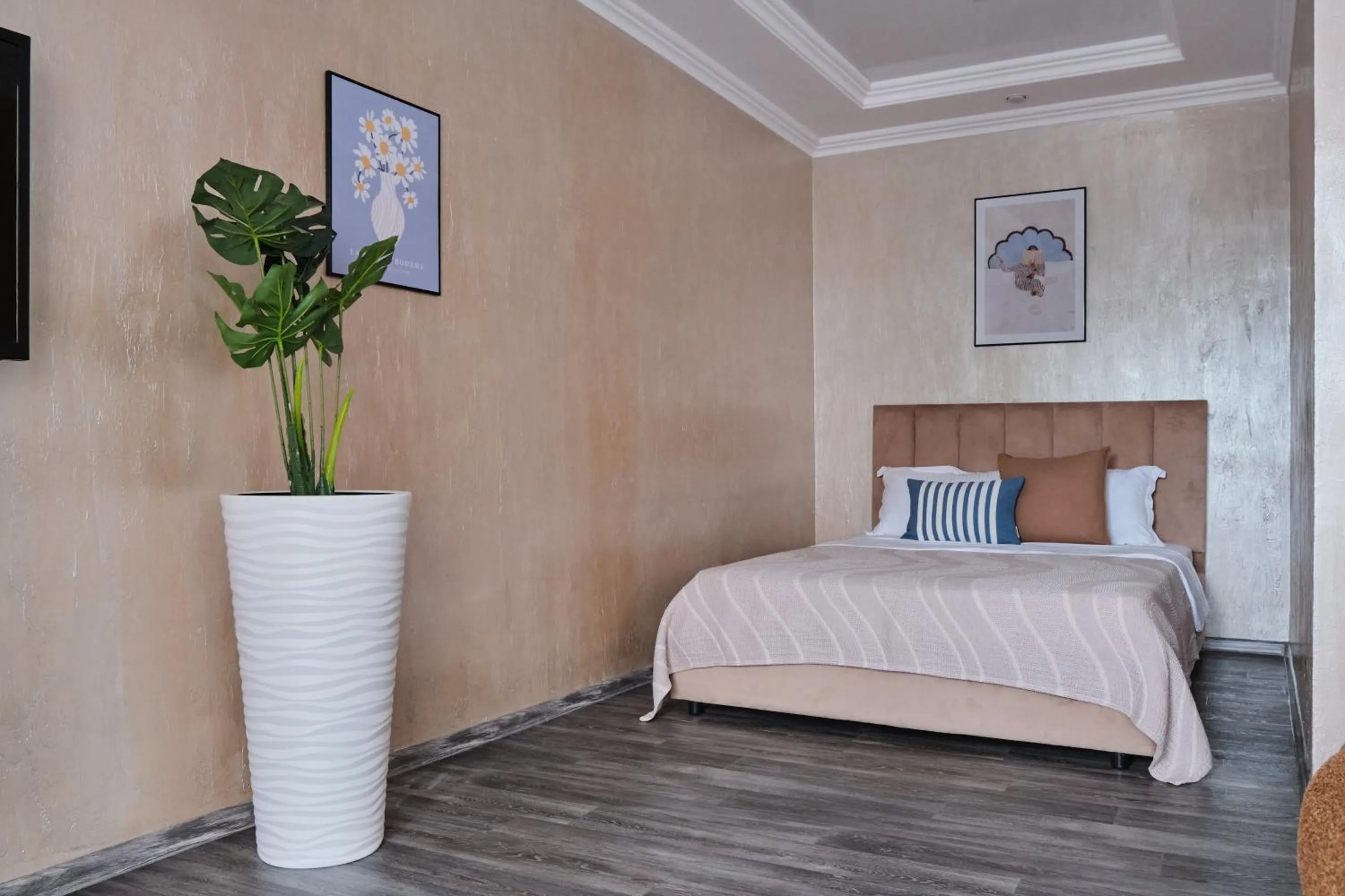 Bed in Seven City Apartments