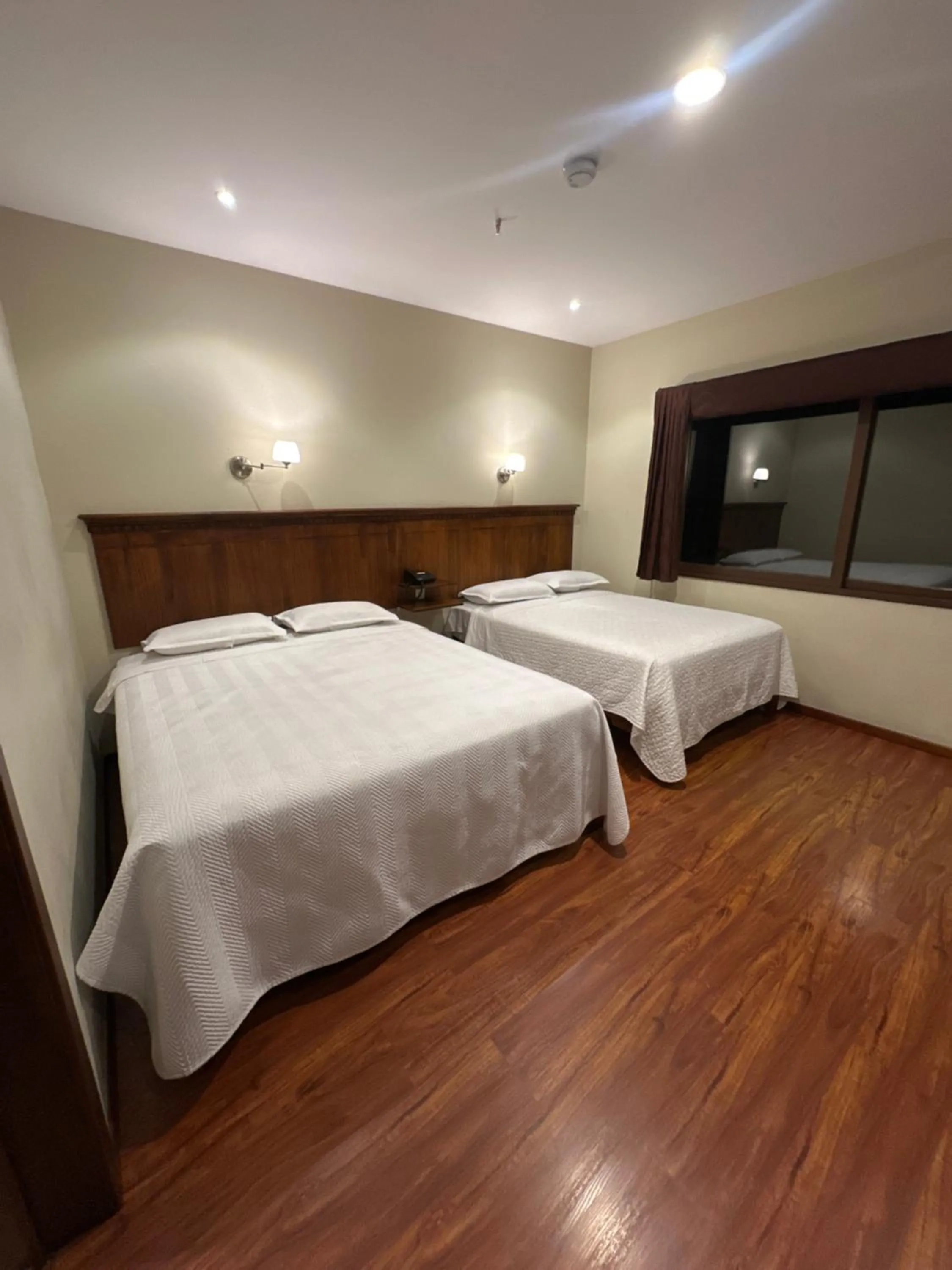 Bed in Hotel & Suites El Quijote