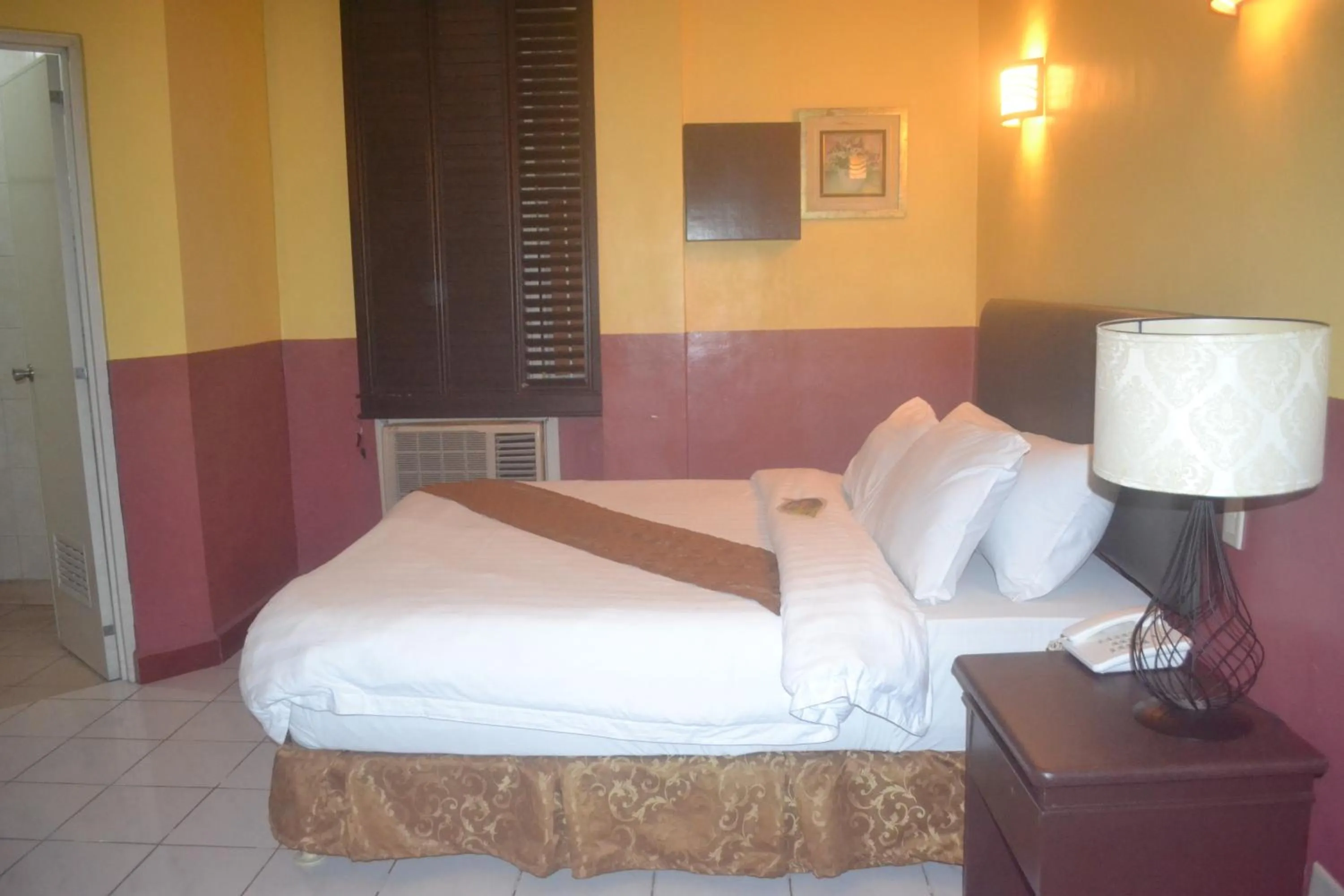 Bed in DM Residente Hotel Inns & Villas