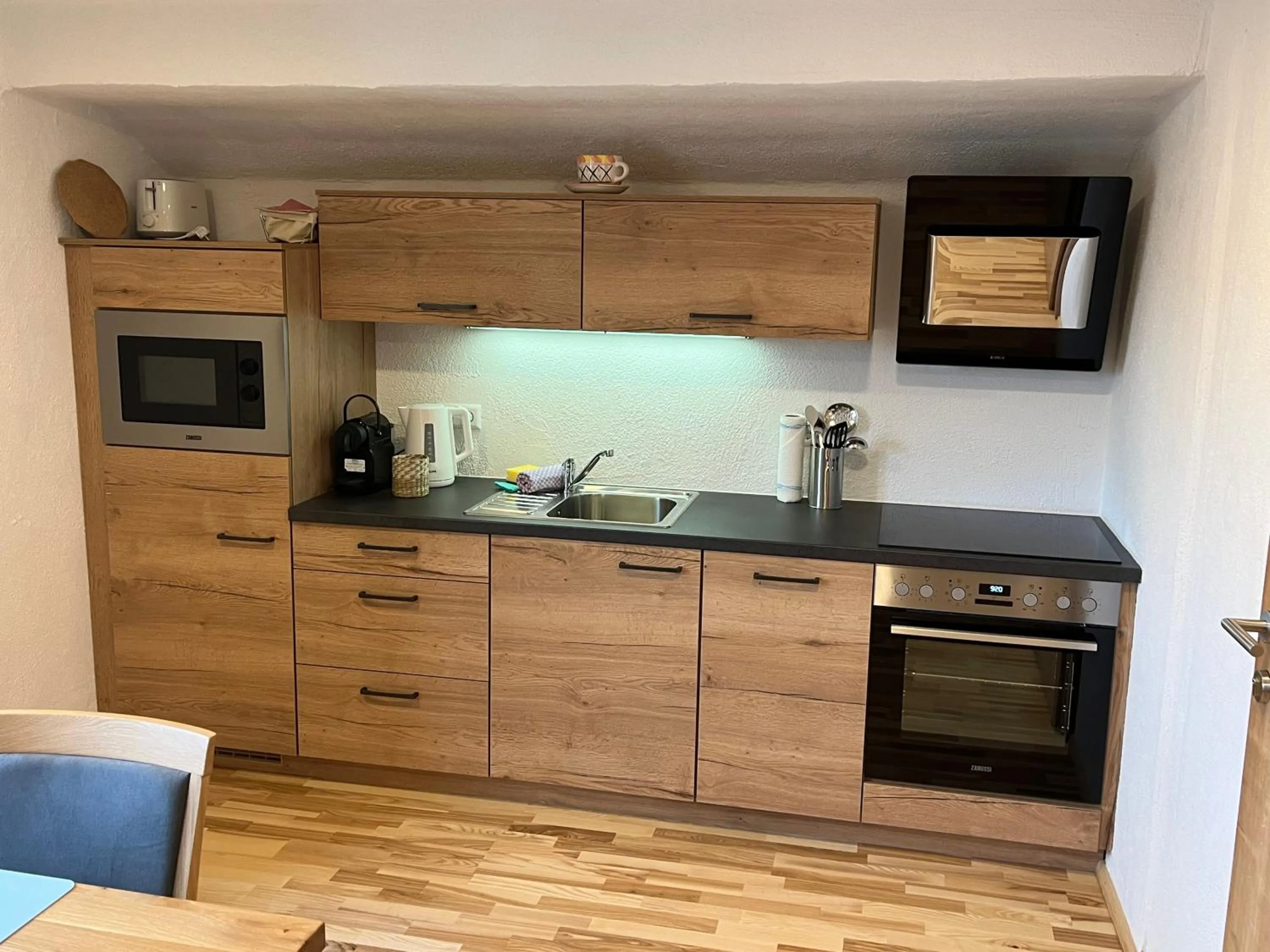 Kitchen or kitchenette in Appartements-Restaurant Schwaiger