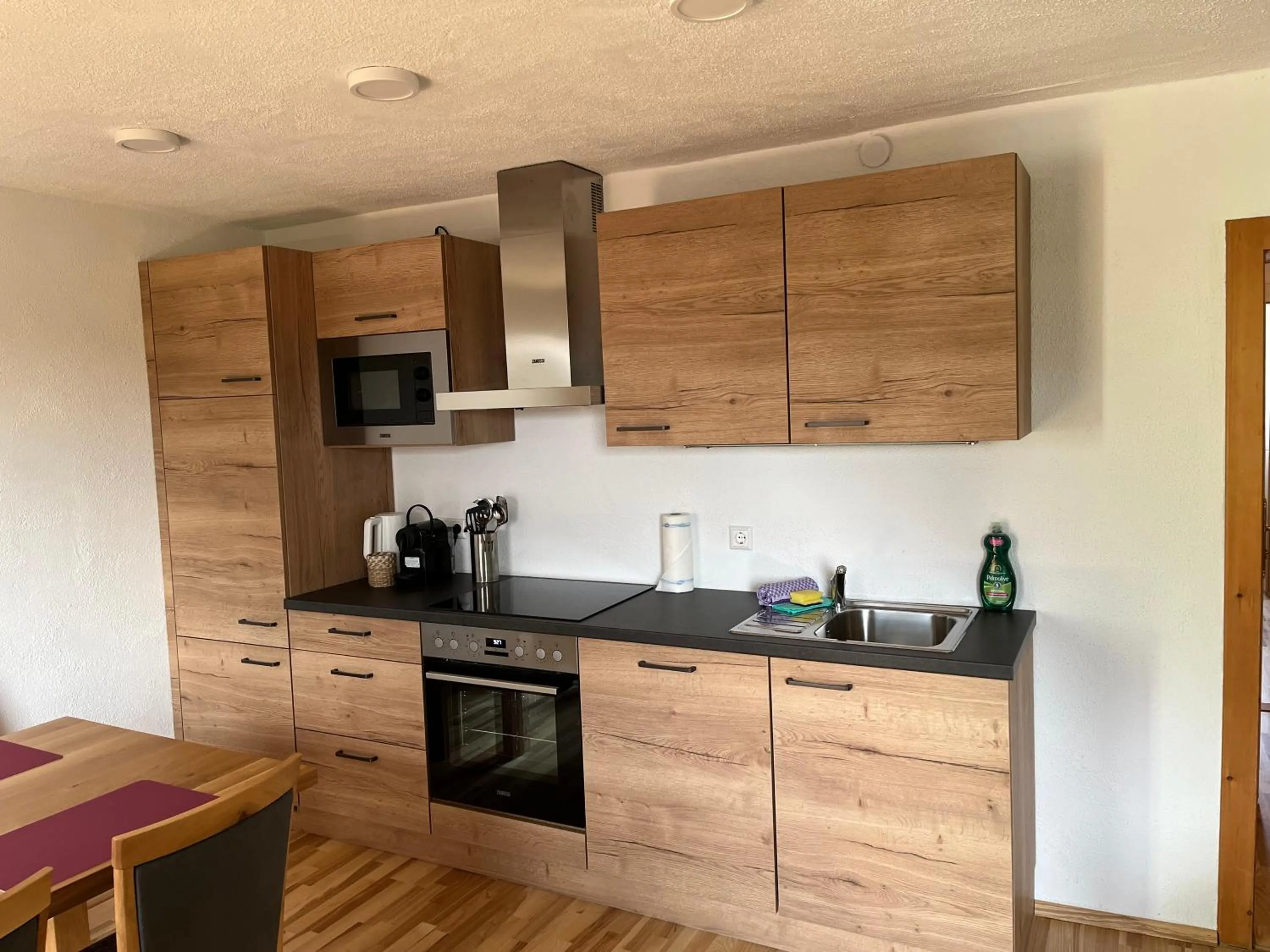 Kitchen or kitchenette in Appartements-Restaurant Schwaiger