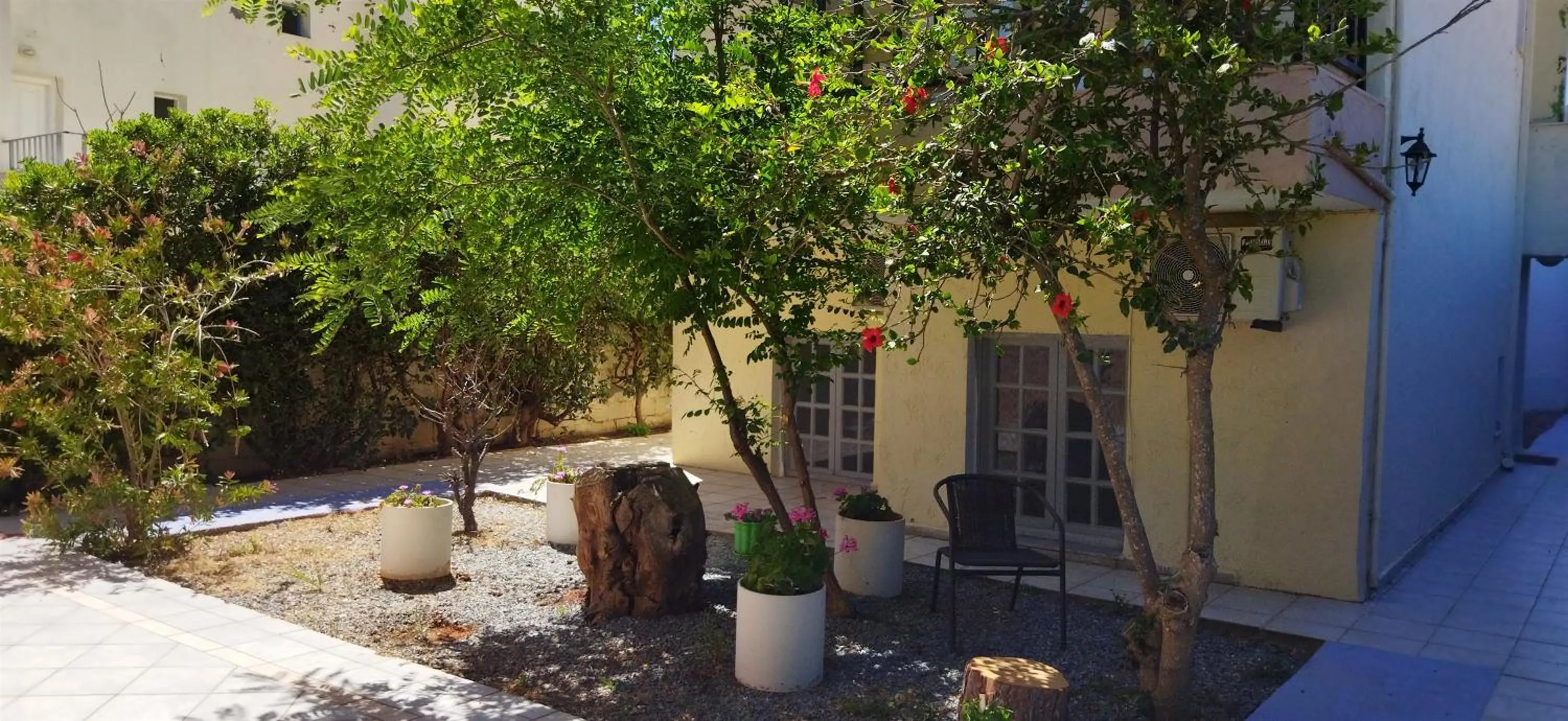 Property building in Cleo Rooms 250m from the beach