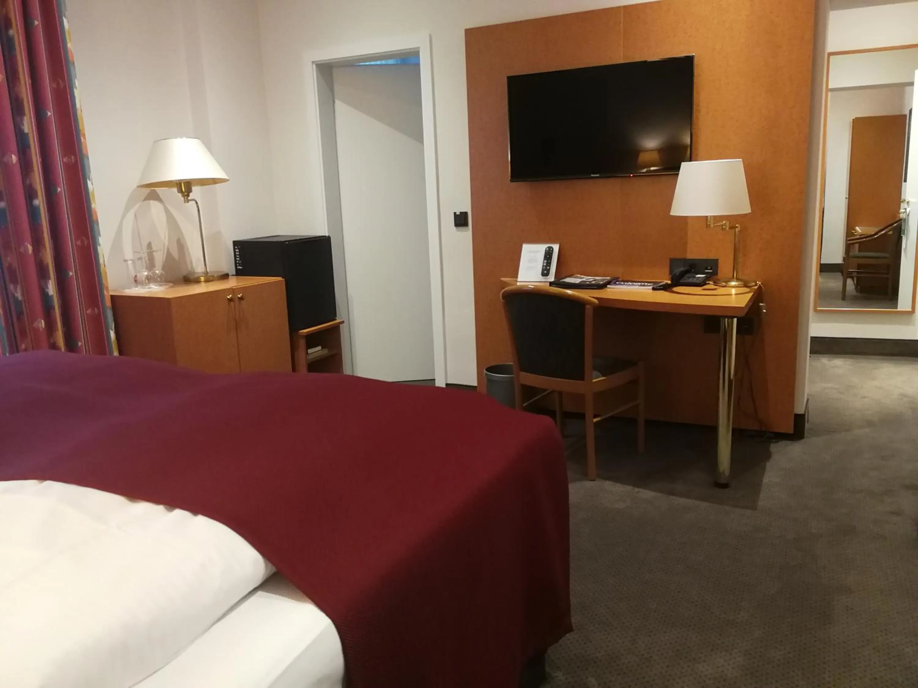 Communal lounge/ TV room, Bed in Hotel An der Philharmonie