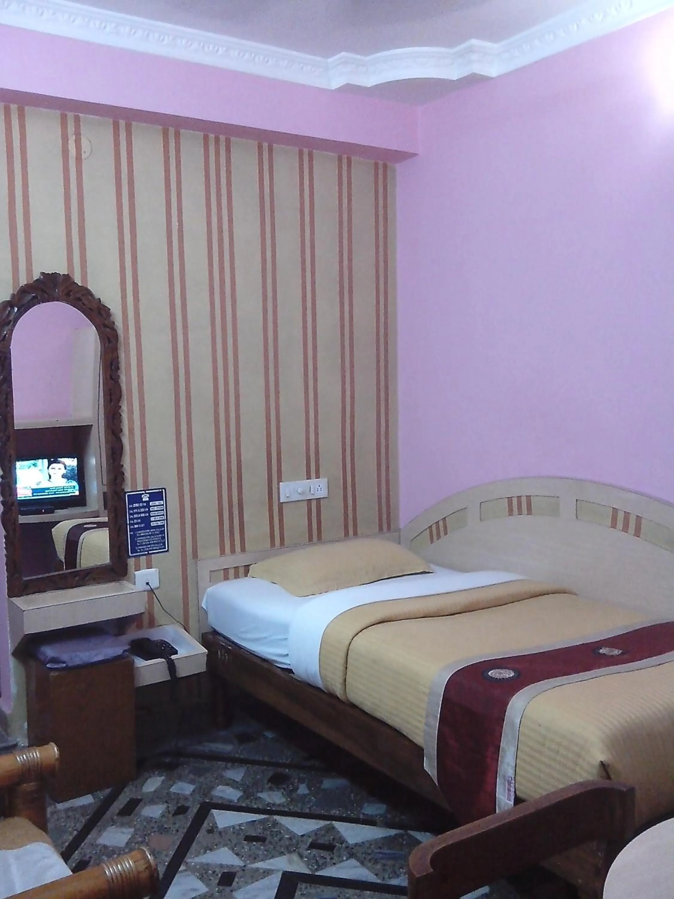 Bed in Hotel Mahalaxmi Indo Myanmar