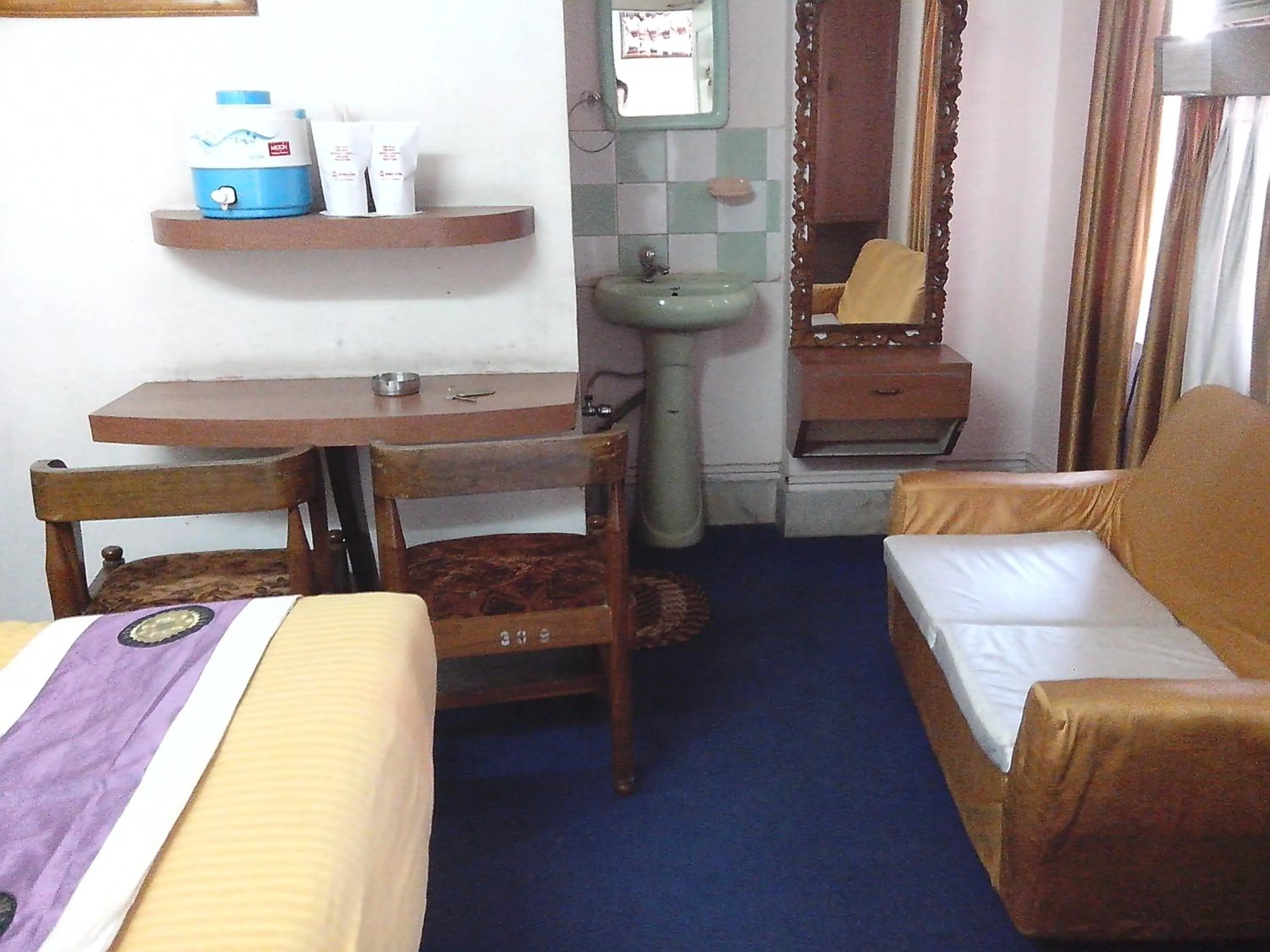 Photo of the whole room, Bed in Hotel Mahalaxmi Indo Myanmar