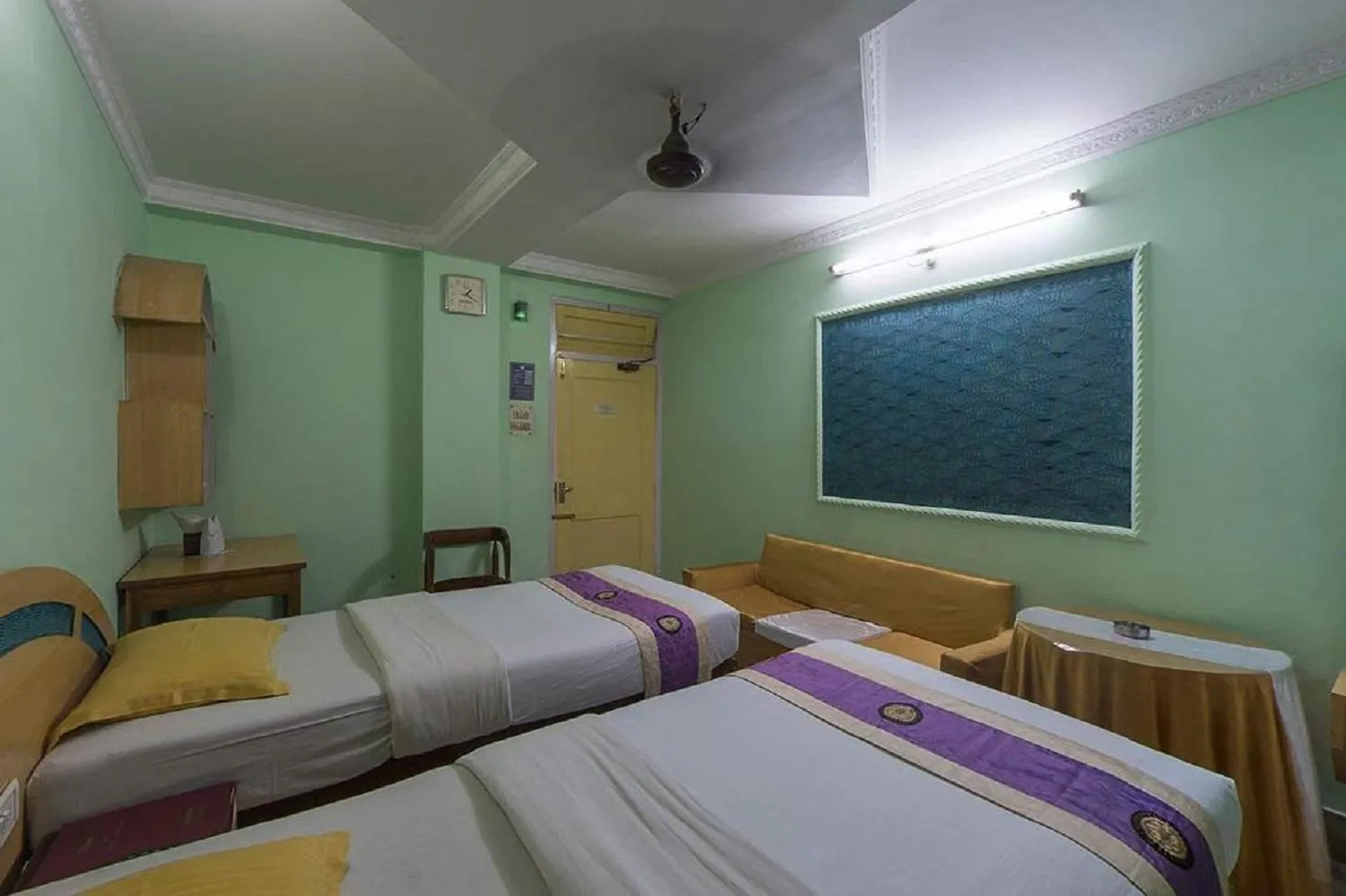 Bed in Hotel Mahalaxmi Indo Myanmar