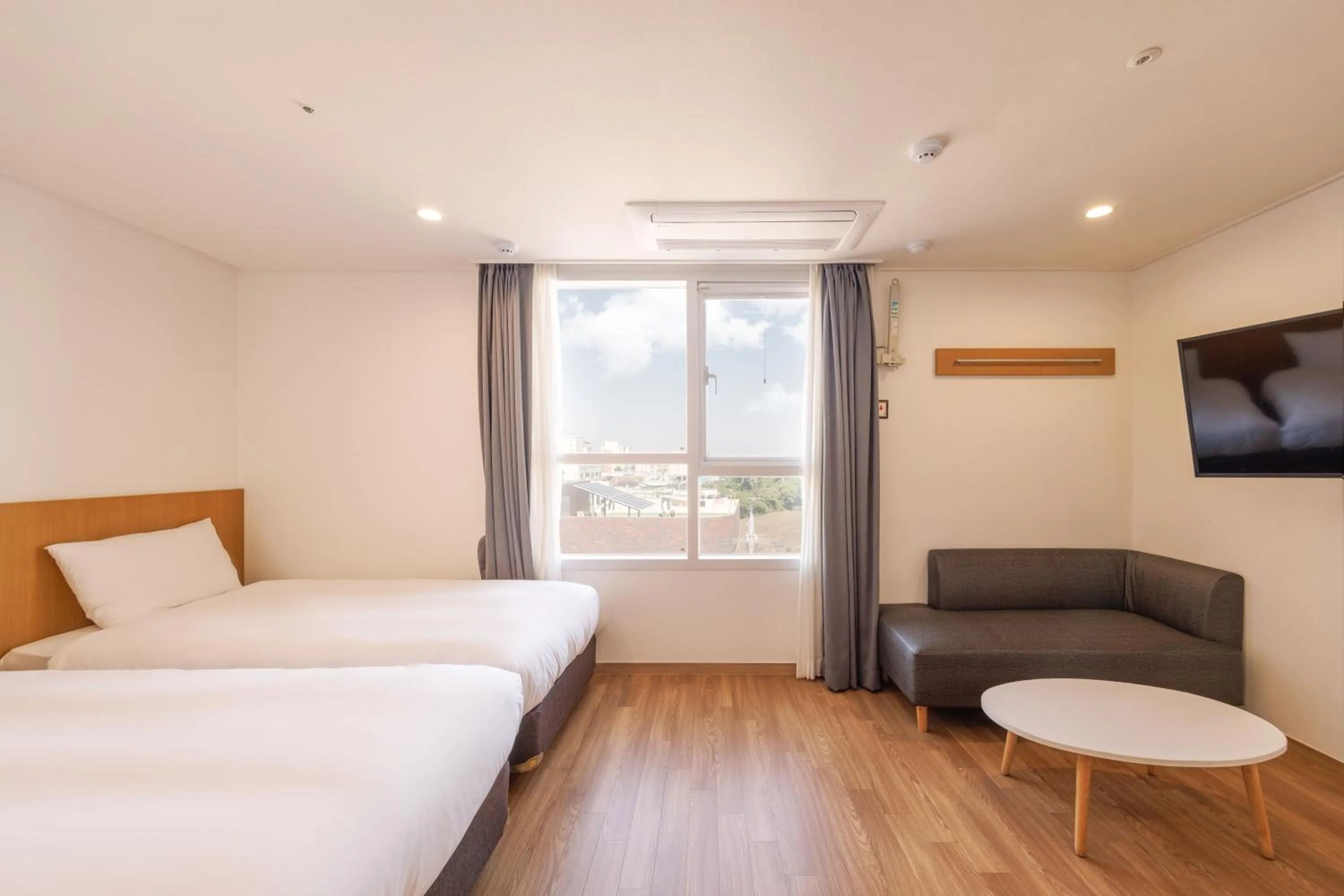 Bed in Kenny Stay Jeju Mosulpo