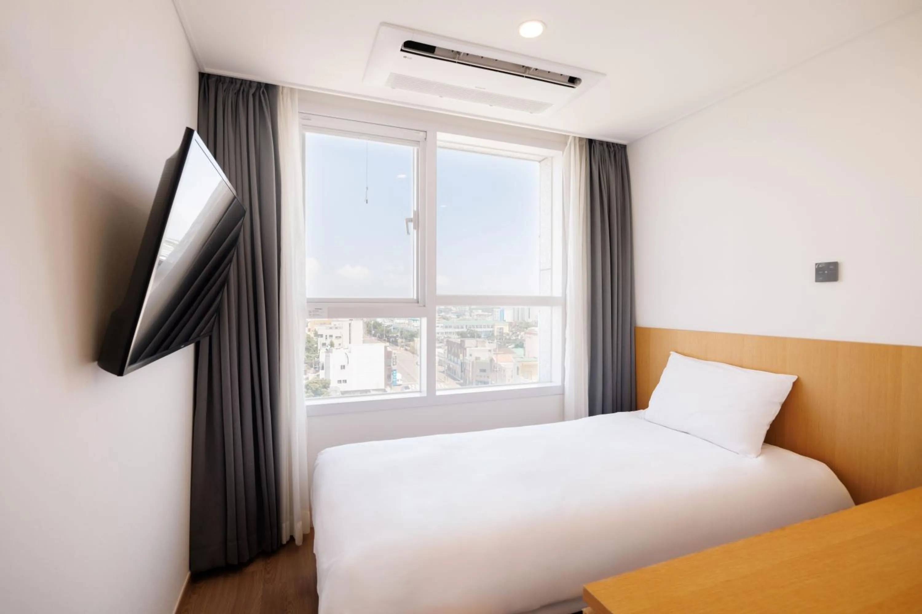 Bed in Kenny Stay Jeju Mosulpo