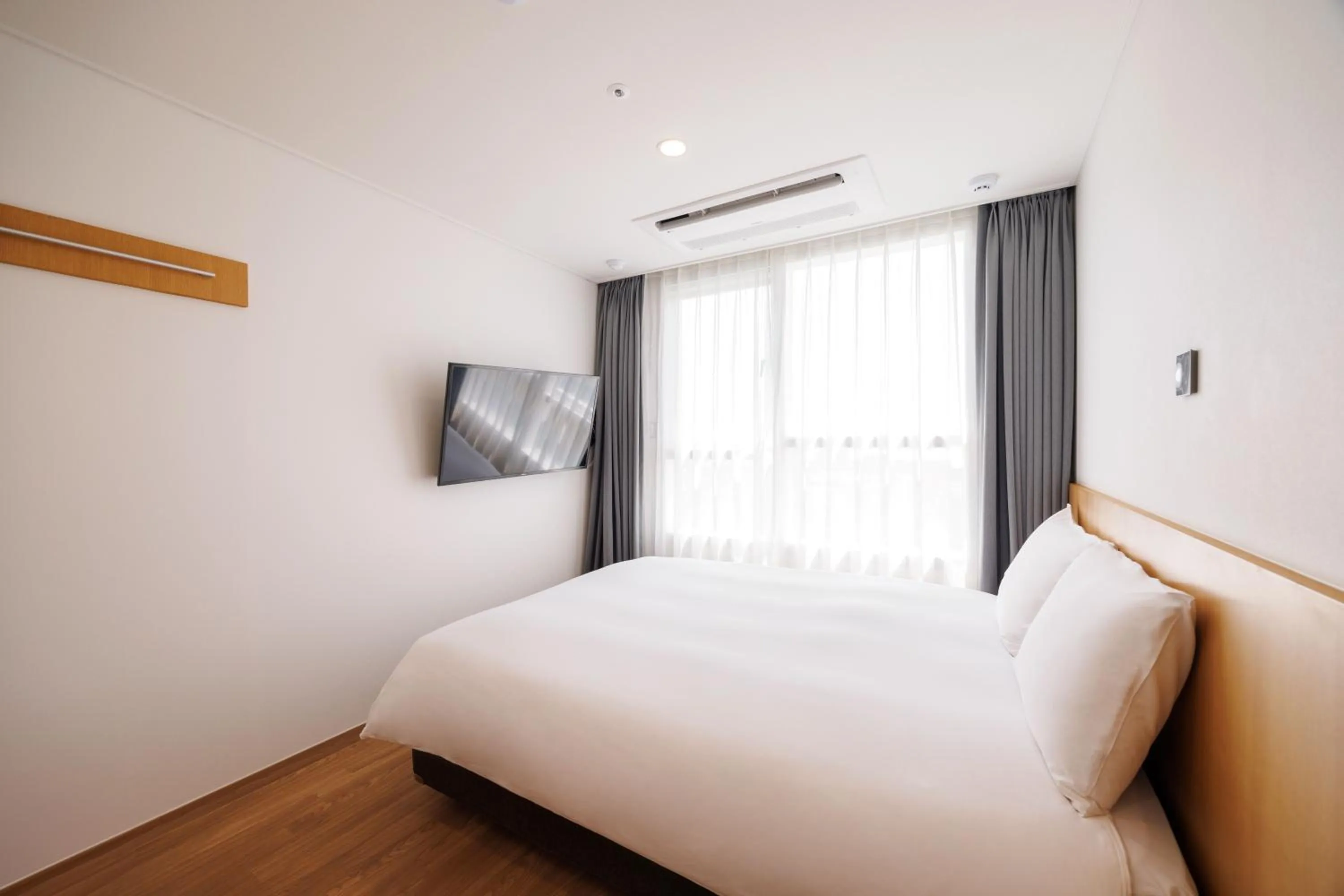 Bed in Kenny Stay Jeju Mosulpo