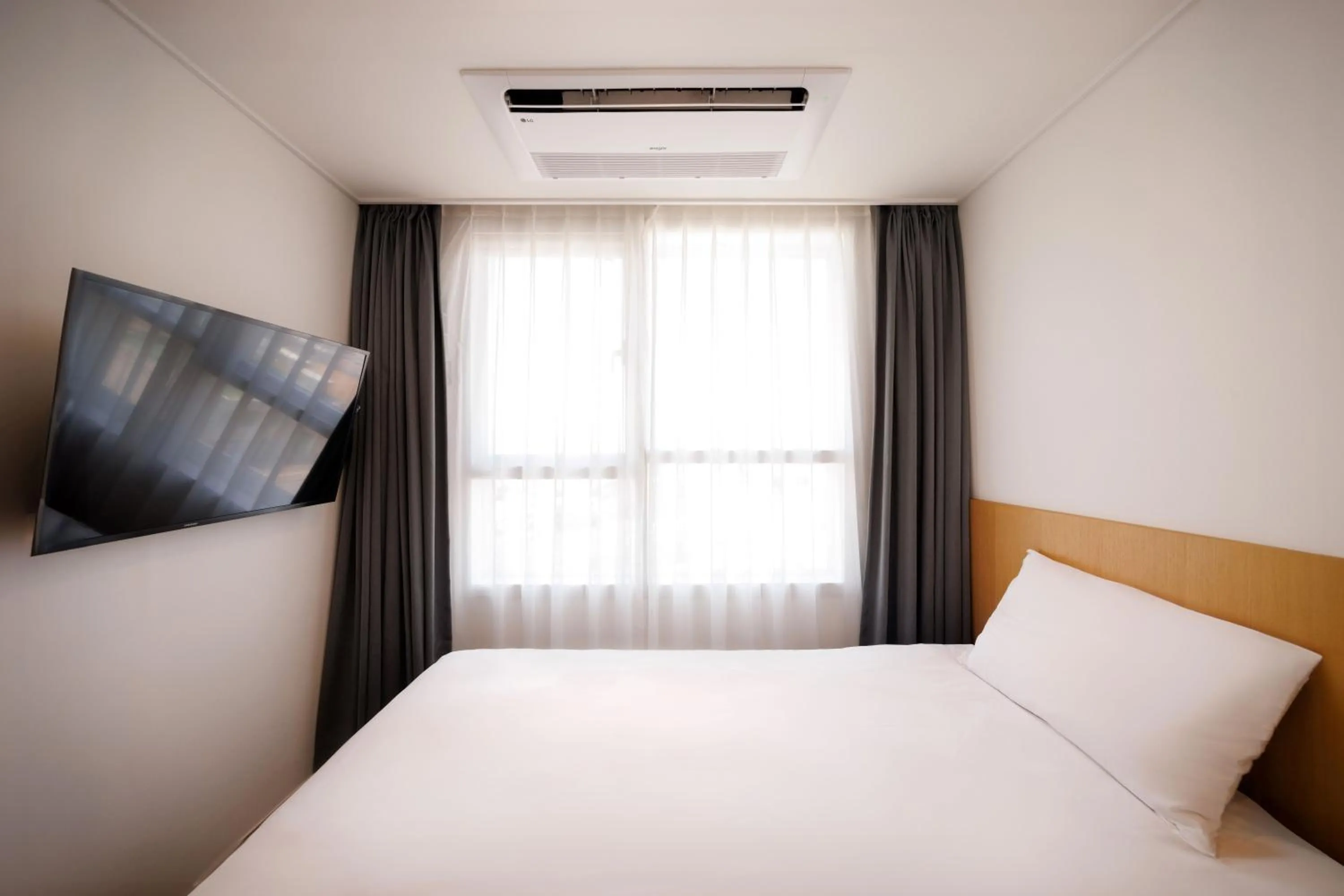 Bed in Kenny Stay Jeju Mosulpo