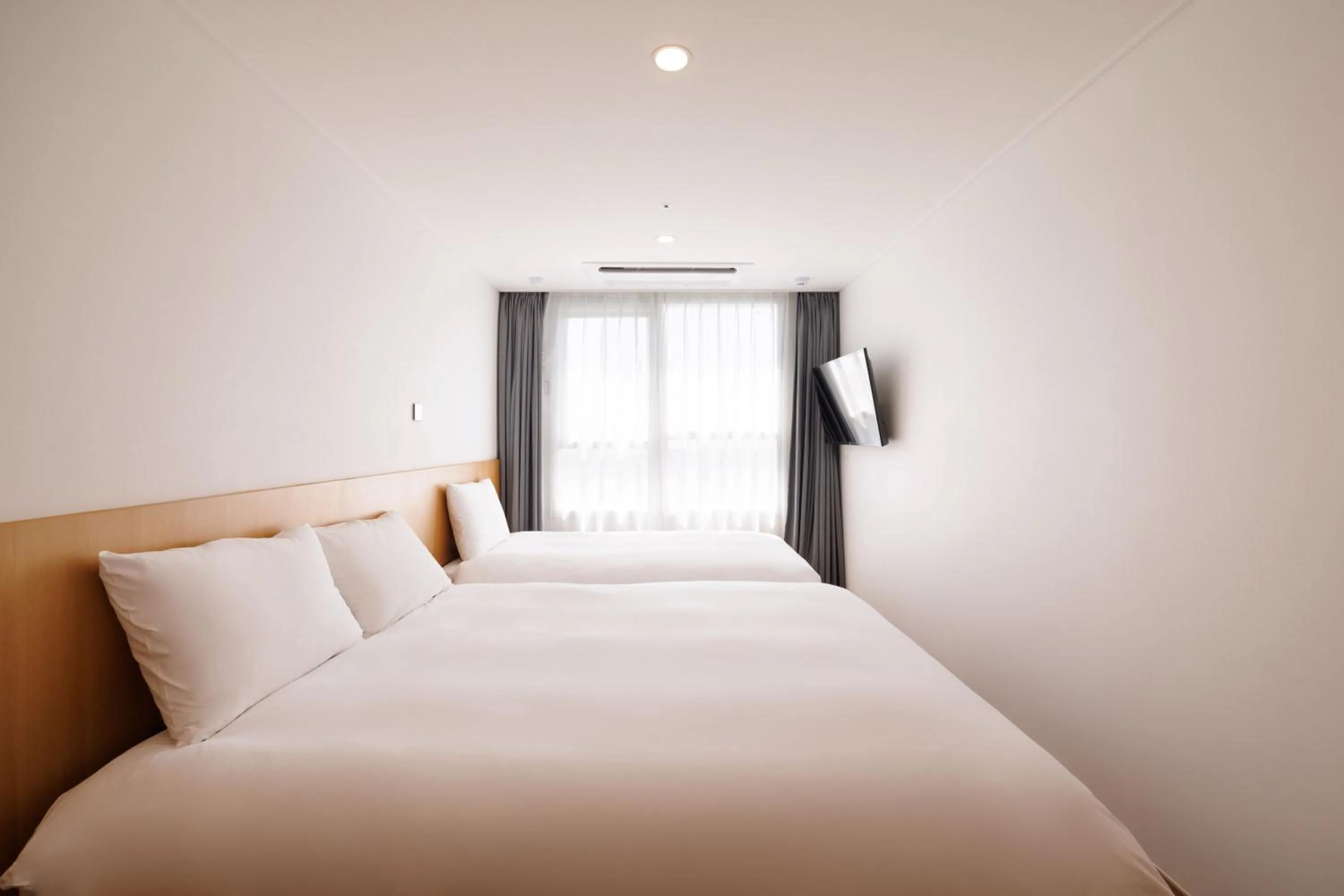 Bed in Kenny Stay Jeju Mosulpo