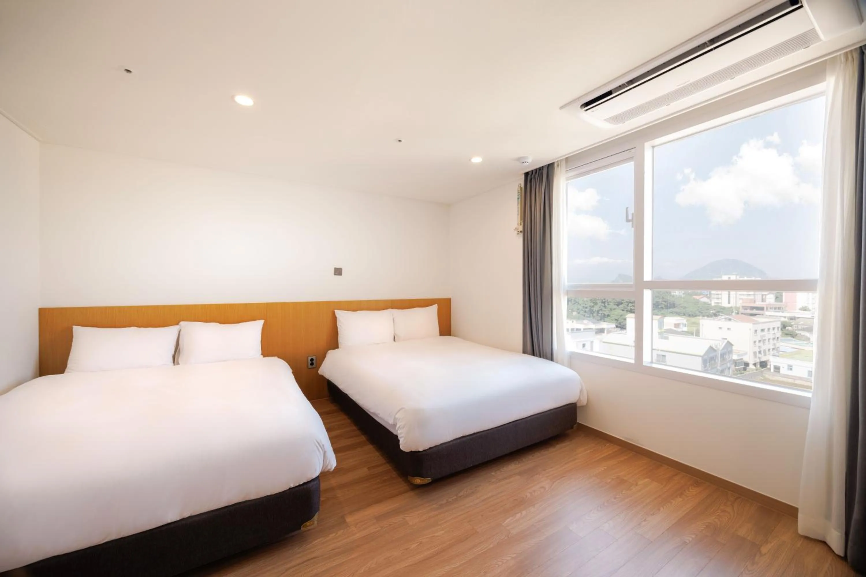 Bed in Kenny Stay Jeju Mosulpo