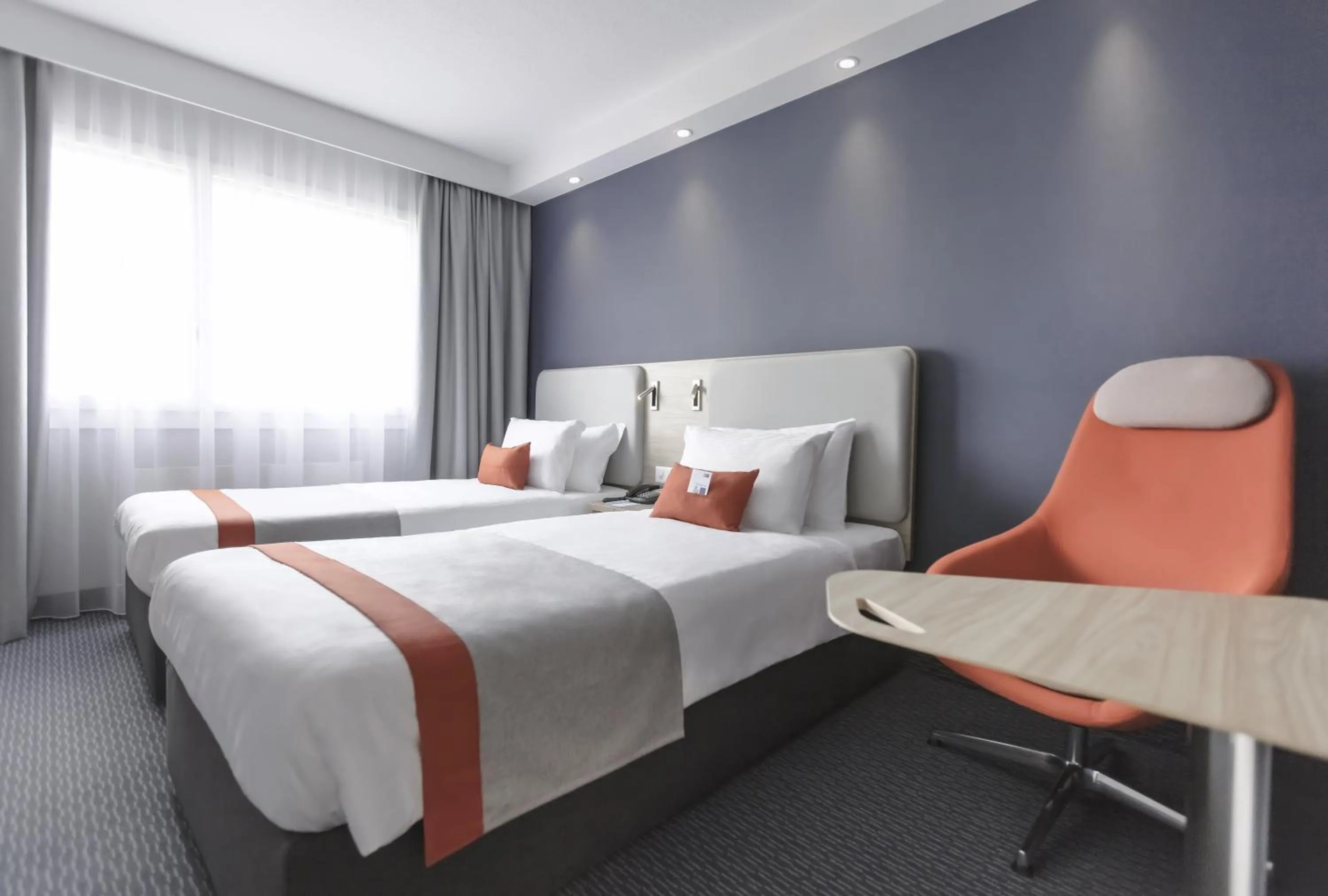 Photo of the whole room, Bed in Holiday Inn Express Luzern-Neuenkirch by IHG