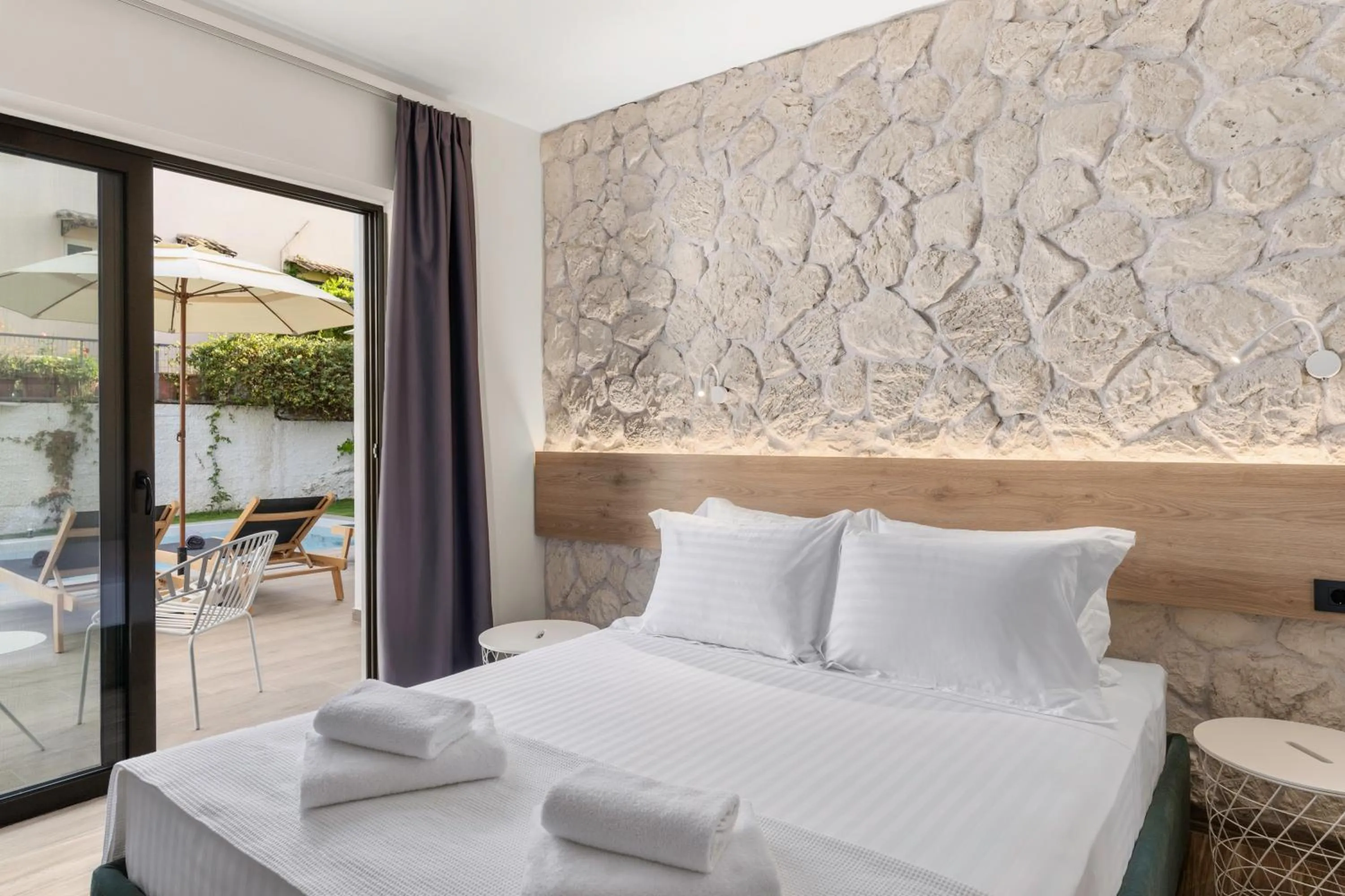 Bed in Sigma Luxury Rooms