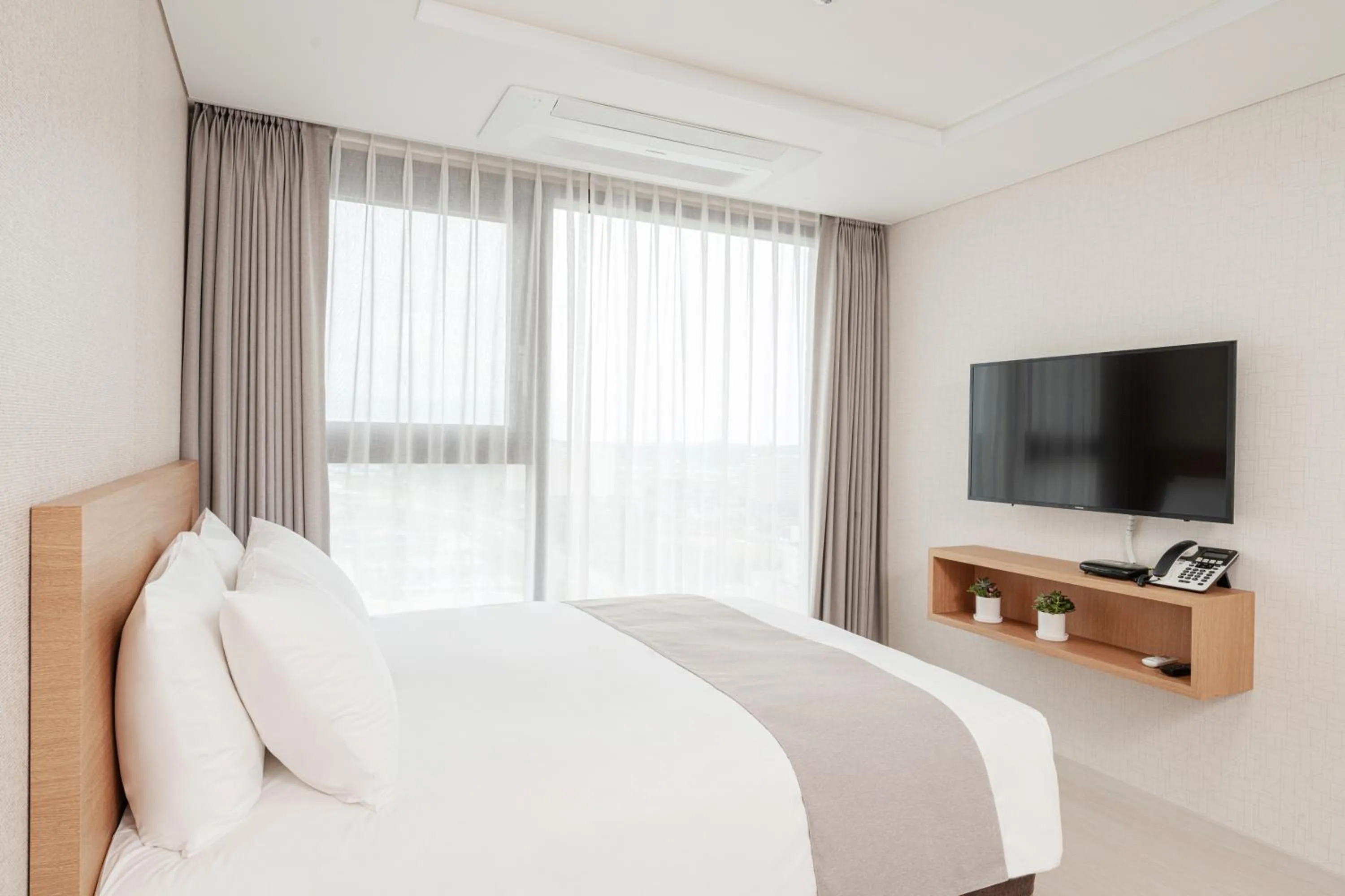 Bed in CENTUMMARK Hotel YangYang