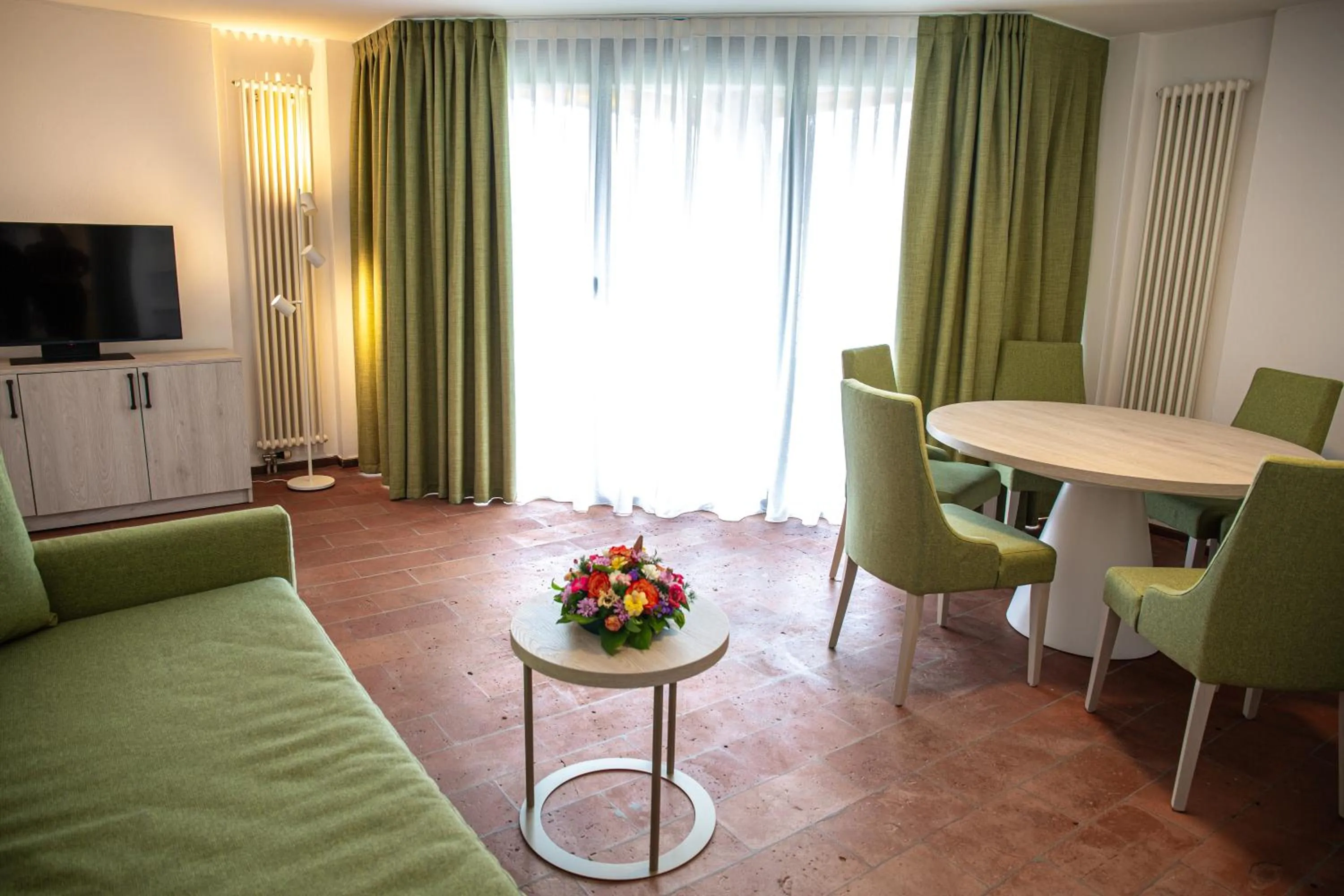 Communal lounge/ TV room in Hotel Nessi Locarno