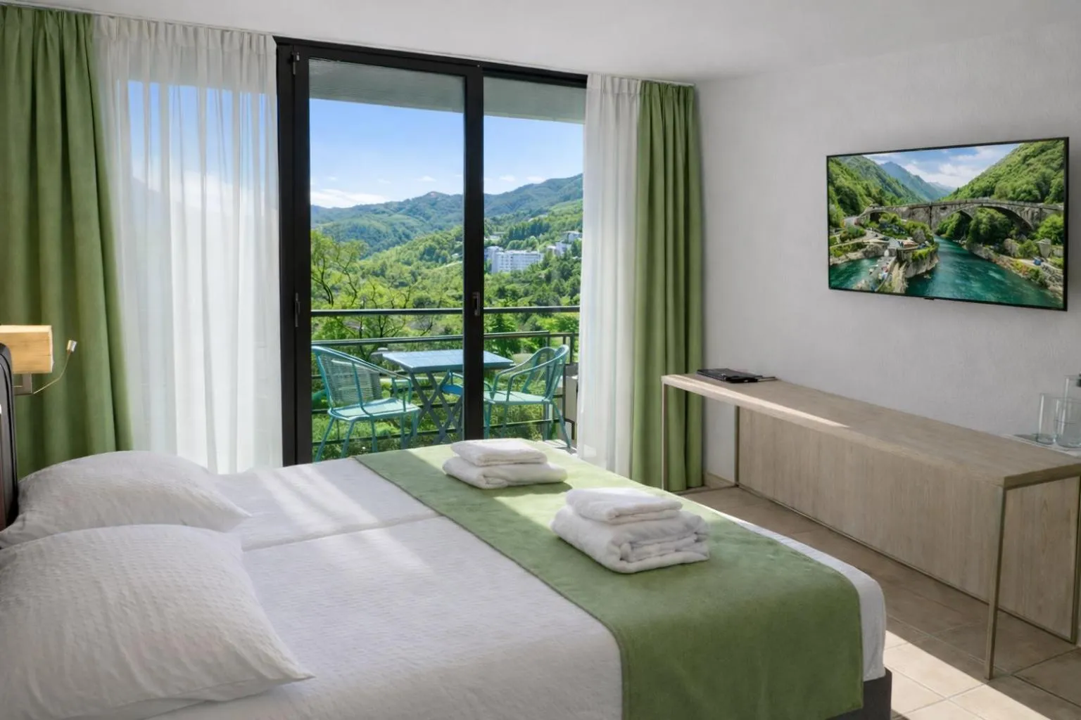 Photo of the whole room, Bed in Hotel Nessi Locarno