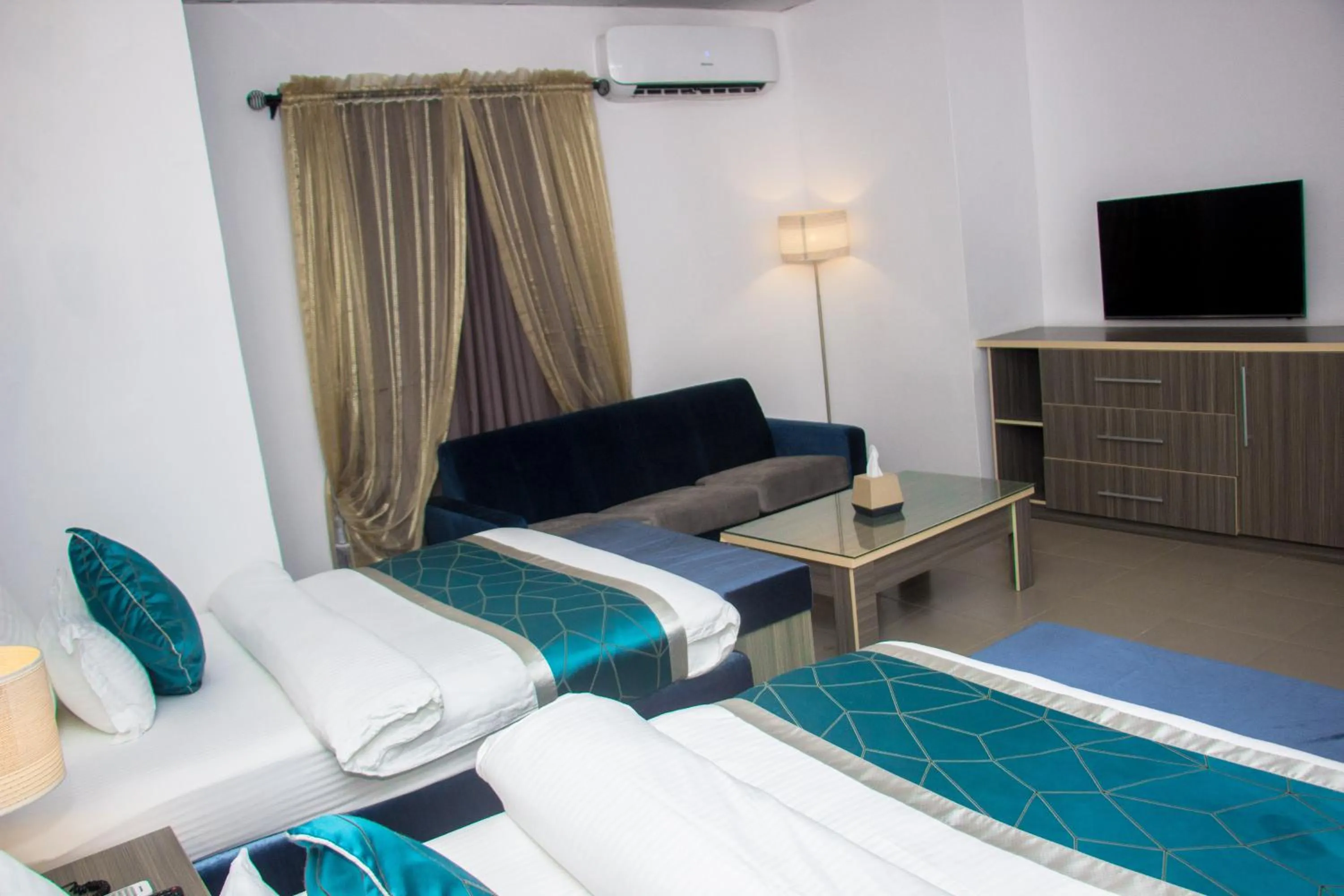 Bed in Riviera Suites