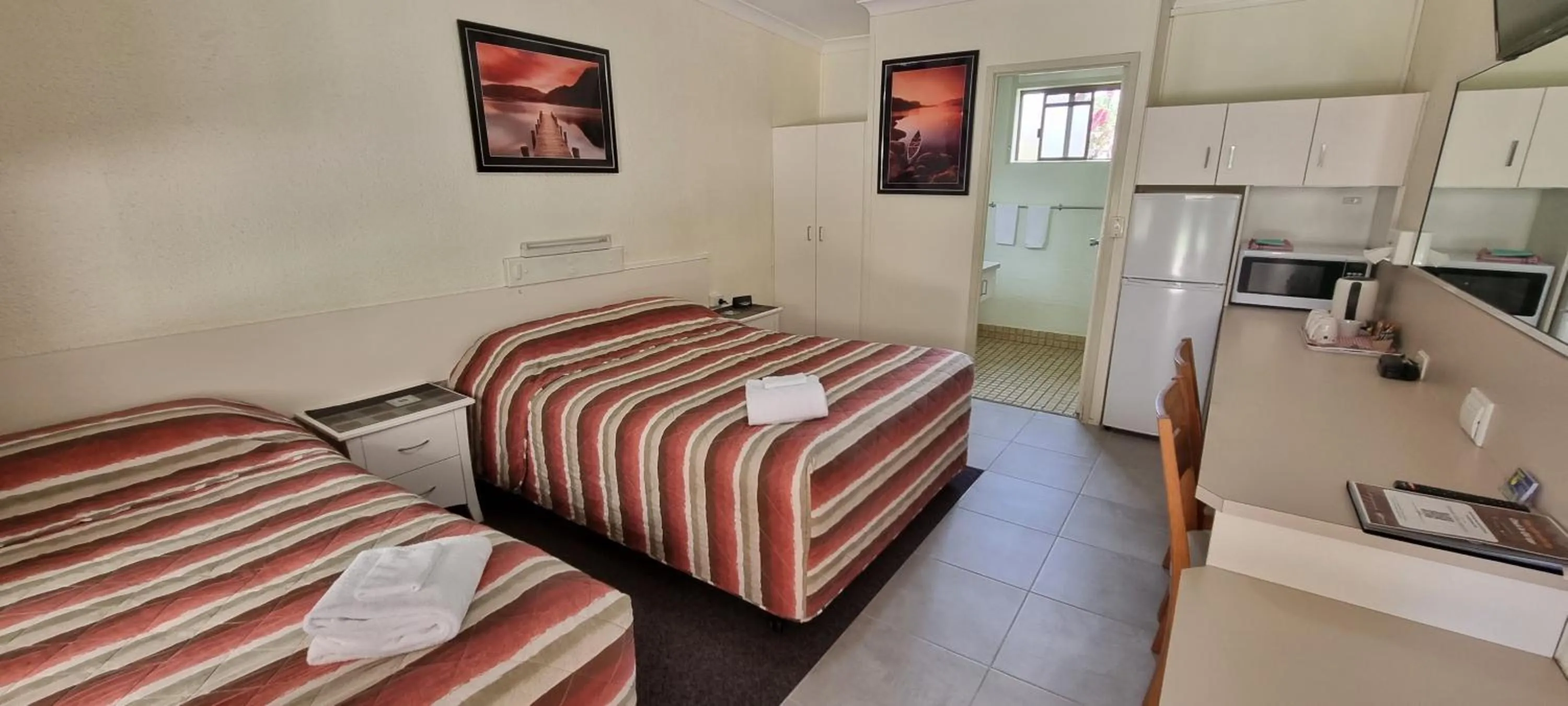 Photo of the whole room, Bed in Benaraby Hilltop MotorInn