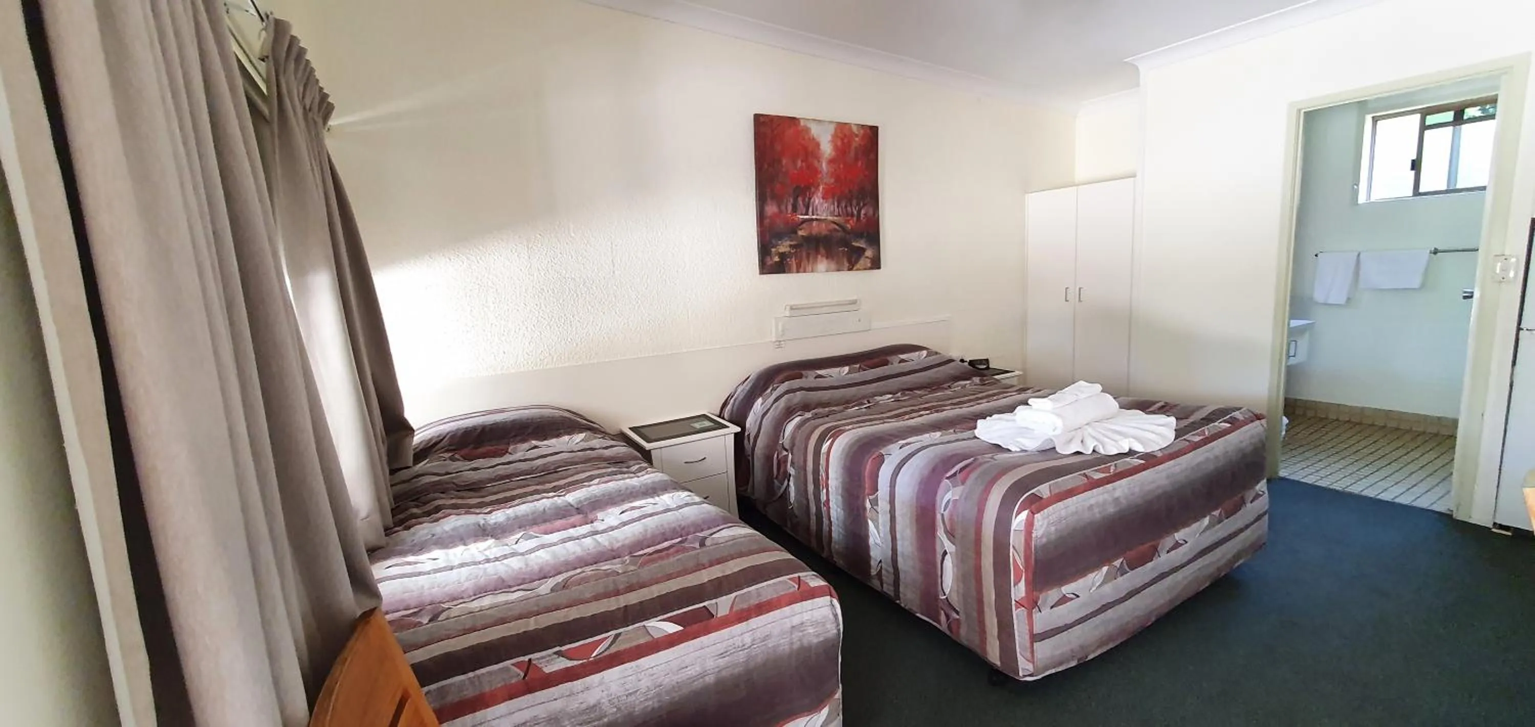 Photo of the whole room, Bed in Benaraby Hilltop MotorInn